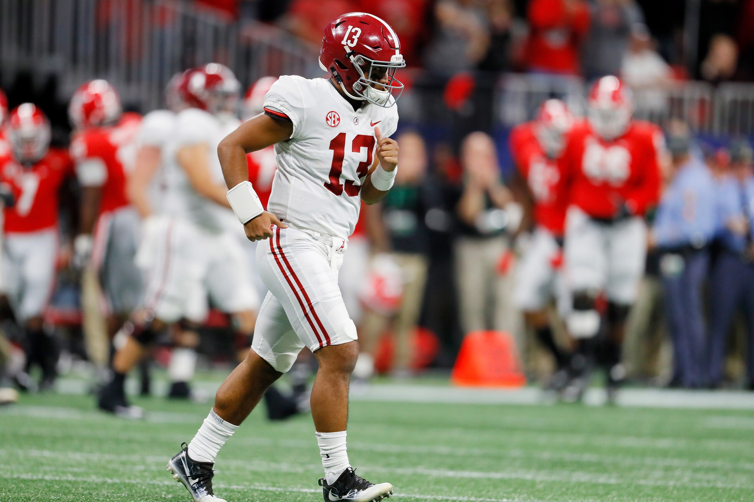 ATLANTA, GA - DECEMBER 01:  Tua Tagovailoa #13 of the Alabama Crimson Tide reacts after throwing an interception in the first half against the Georgia Bulldogs during the 2018 SEC Championship Game at Mercedes-Benz Stadium on December 1, 2018 in Atlanta, 