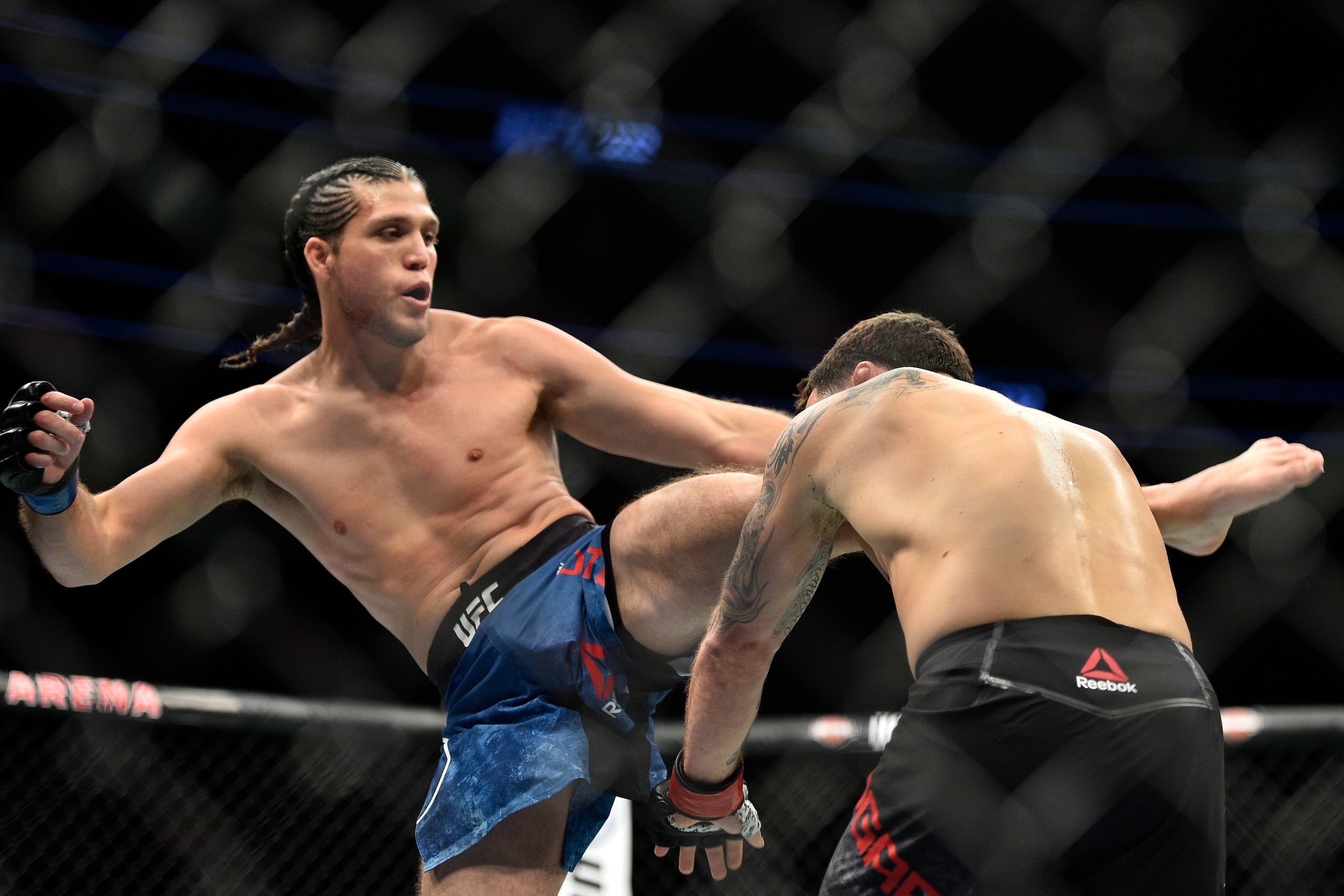 LAS VEGAS, NV - MARCH 03:   (L-R) Brian Ortega kicks Frankie Edgar in their featherweight bout during the UFC 222 event inside T-Mobile Arena on March 3, 2018 in Las Vegas, Nevada. (Photo by Brandon Magnus/Zuffa LLC/Zuffa LLC via Getty Images)