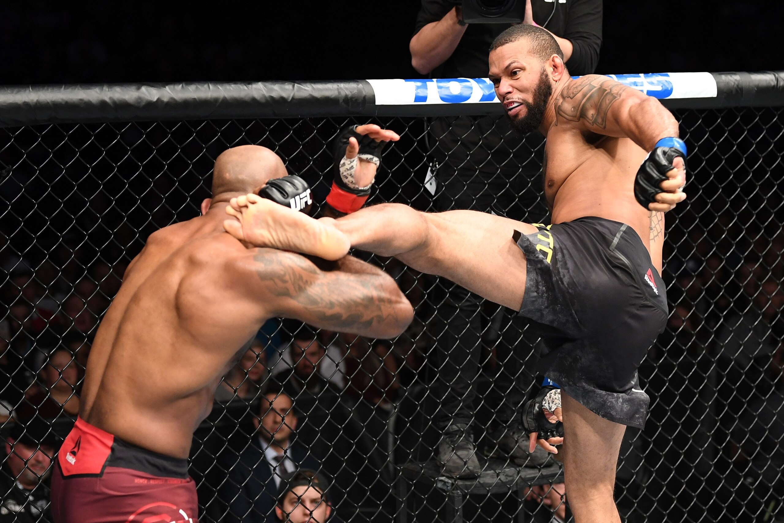 TORONTO, CANADA - DECEMBER 08:  (R-L) Thiago Santos of Brazil kicks Jimi Manuwa of England in their light heavyweight fight during the UFC 231 event at Scotiabank Arena on December 8, 2018 in Toronto, Canada. (Photo by Josh Hedges/Zuffa LLC/Zuffa LLC via 