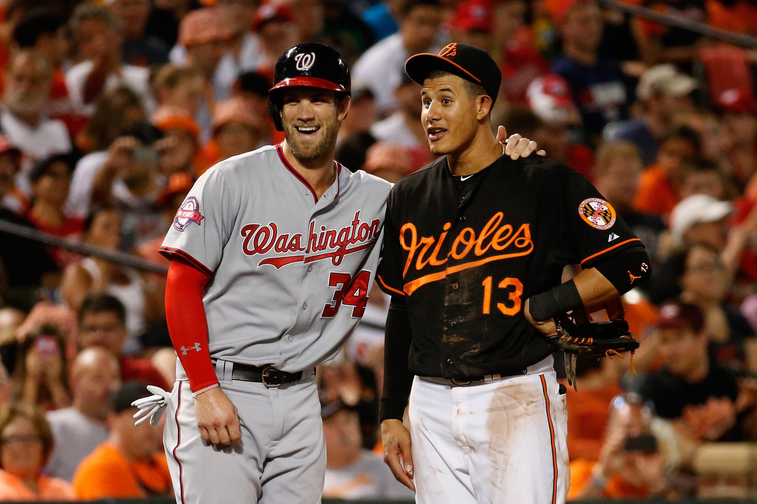 BALTIMORE, MD - JULY 10: Bryce Harper #34 of the Washington Nationals and Manny Machado #13 of the Baltimore Orioles talk during their game at Oriole Park at Camden Yards on July 10, 2015 in Baltimore, Maryland. (Photo by Rob Carr/Getty Images) BALTIMORE, MD - JULY 10: Bryce Harper #34 of the Washington Nationals and Manny Machado #13 of the Baltimore Orioles talk during their game at Oriole Park at Camden Yards on July 10, 2015 in Baltimore, Maryland. (Photo by Rob Carr/Getty Images)