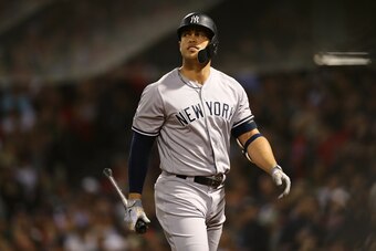 BOSTON, MA - OCTOBER 06: Giancarlo Stanton #27 of the New York Yankees looks on after striking out swinging during fifth inning of Game Two of the American League Division Series against the Boston Red Sox at Fenway Park on October 6, 2018 in Boston, Mass