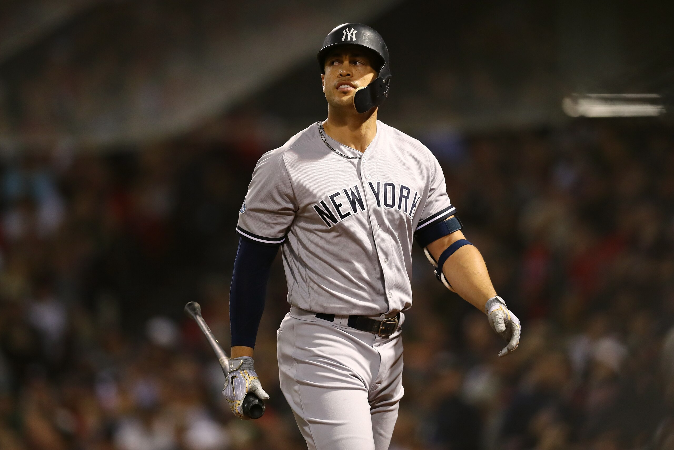 BOSTON, MA - OCTOBER 06: Giancarlo Stanton #27 of the New York Yankees looks on after striking out swinging during fifth inning of Game Two of the American League Division Series against the Boston Red Sox at Fenway Park on October 6, 2018 in Boston, Mass BOSTON, MA - OCTOBER 06: Giancarlo Stanton #27 of the New York Yankees looks on after striking out swinging during fifth inning of Game Two of the American League Division Series against the Boston Red Sox at Fenway Park on October 6, 2018 in Boston, Mass