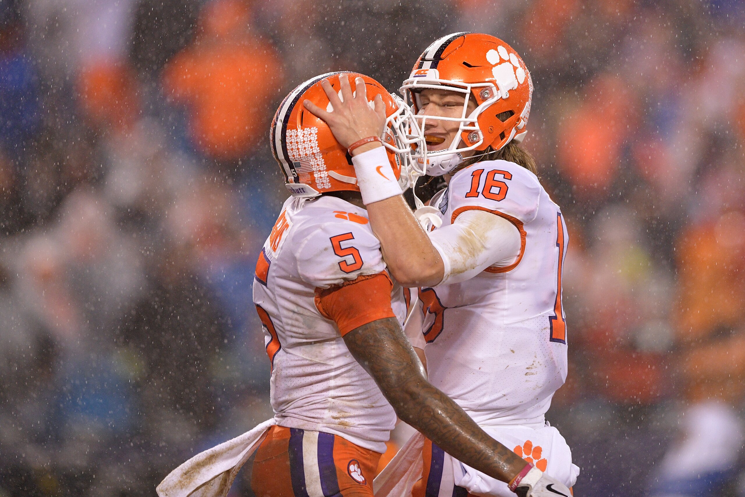CHARLOTTE, NC - DECEMBER 01:  Tee Higgins #5 celebrates with Trevor Lawrence #16 of the Clemson Tigers after scoring a touchdown against the Pittsburgh Panthers during the second quarter of their game at Bank of America Stadium on December 1, 2018 in Char