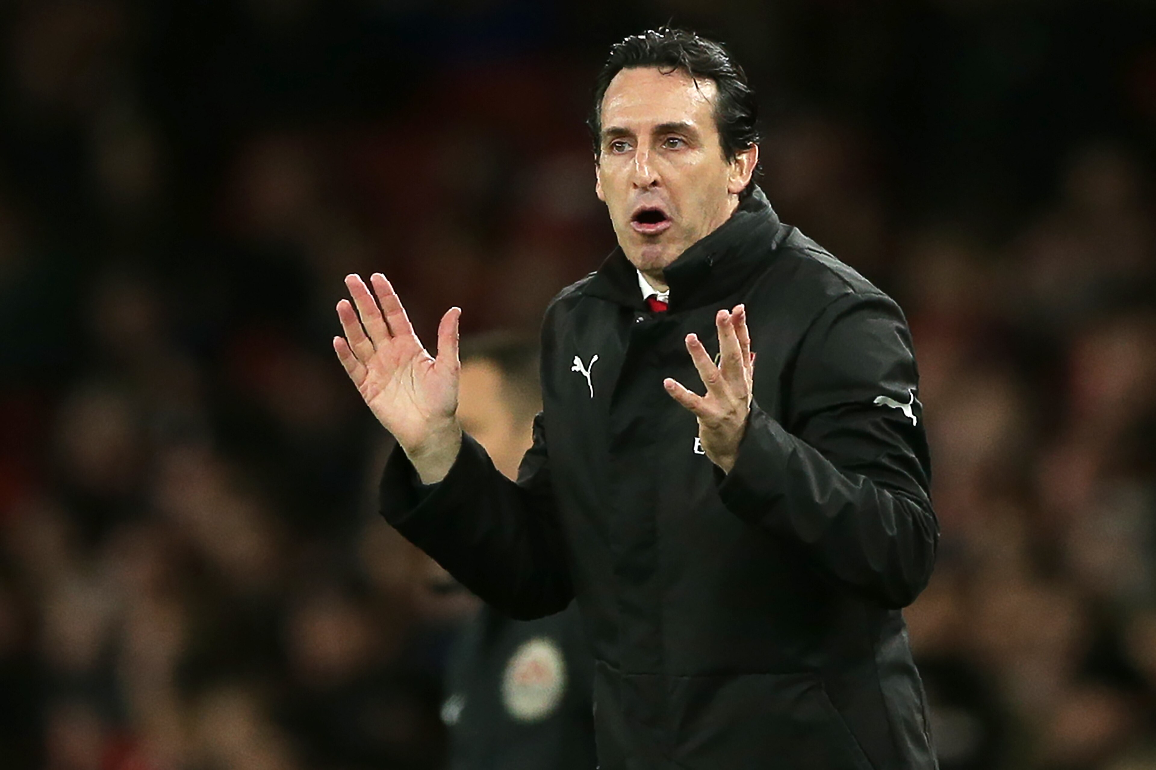 Arsenal's Spanish head coach Unai Emery gestures on the touchline during the English Premier League football match between Arsenal and Huddersfield Town at the Emirates Stadium in London on December 8, 2018. - Arsenal won the game 1-0. (Photo by Daniel LE
