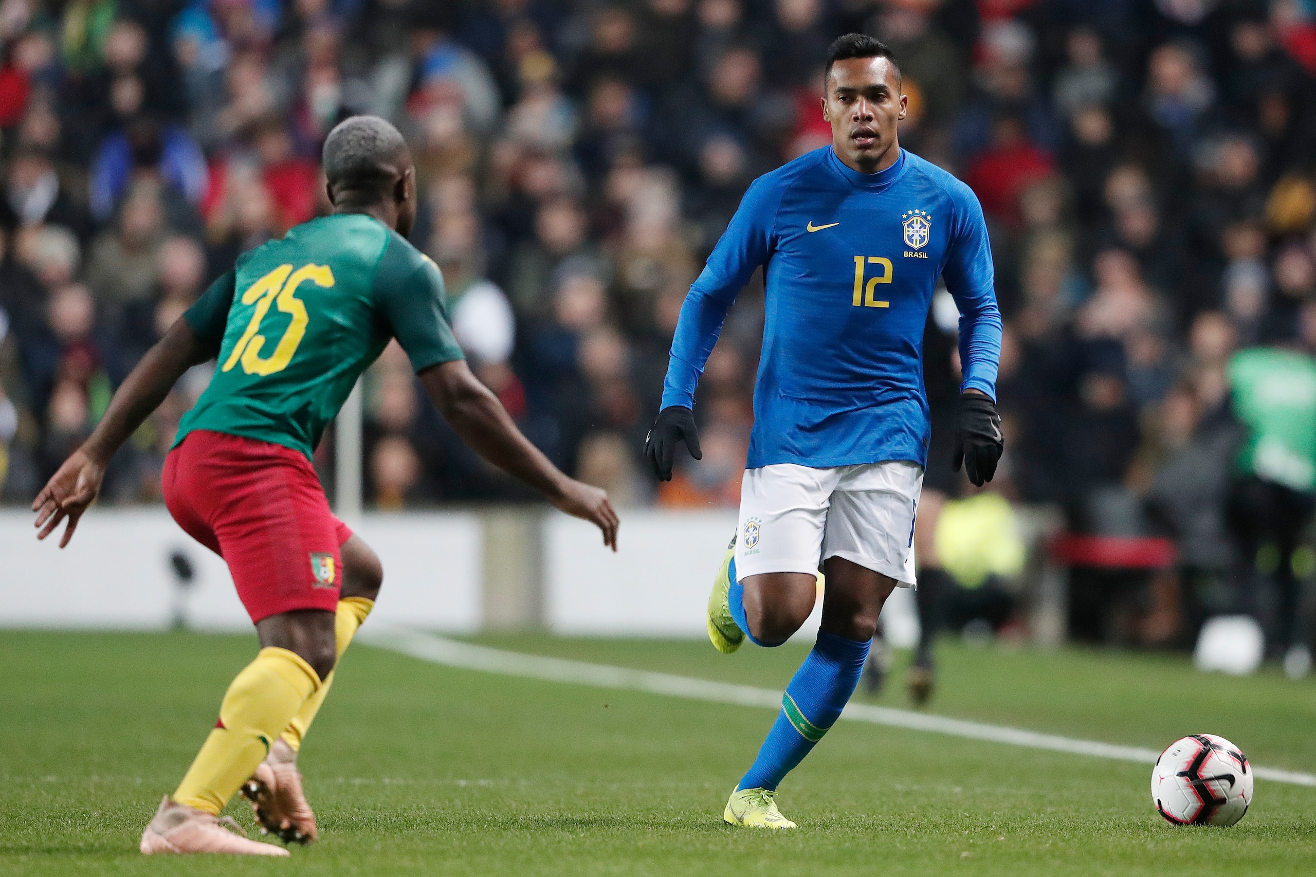 MILTON KEYNES, UNITED KINGDOM - NOVEMBER 20: (L-R) Jeando Fuchs of Cameroon, Alex Sandro of Brazil  during the  International Friendly match between Brazil  v Cameroon  at the Stadium MK on November 20, 2018 in Milton Keynes United Kingdom (Photo by Soccr