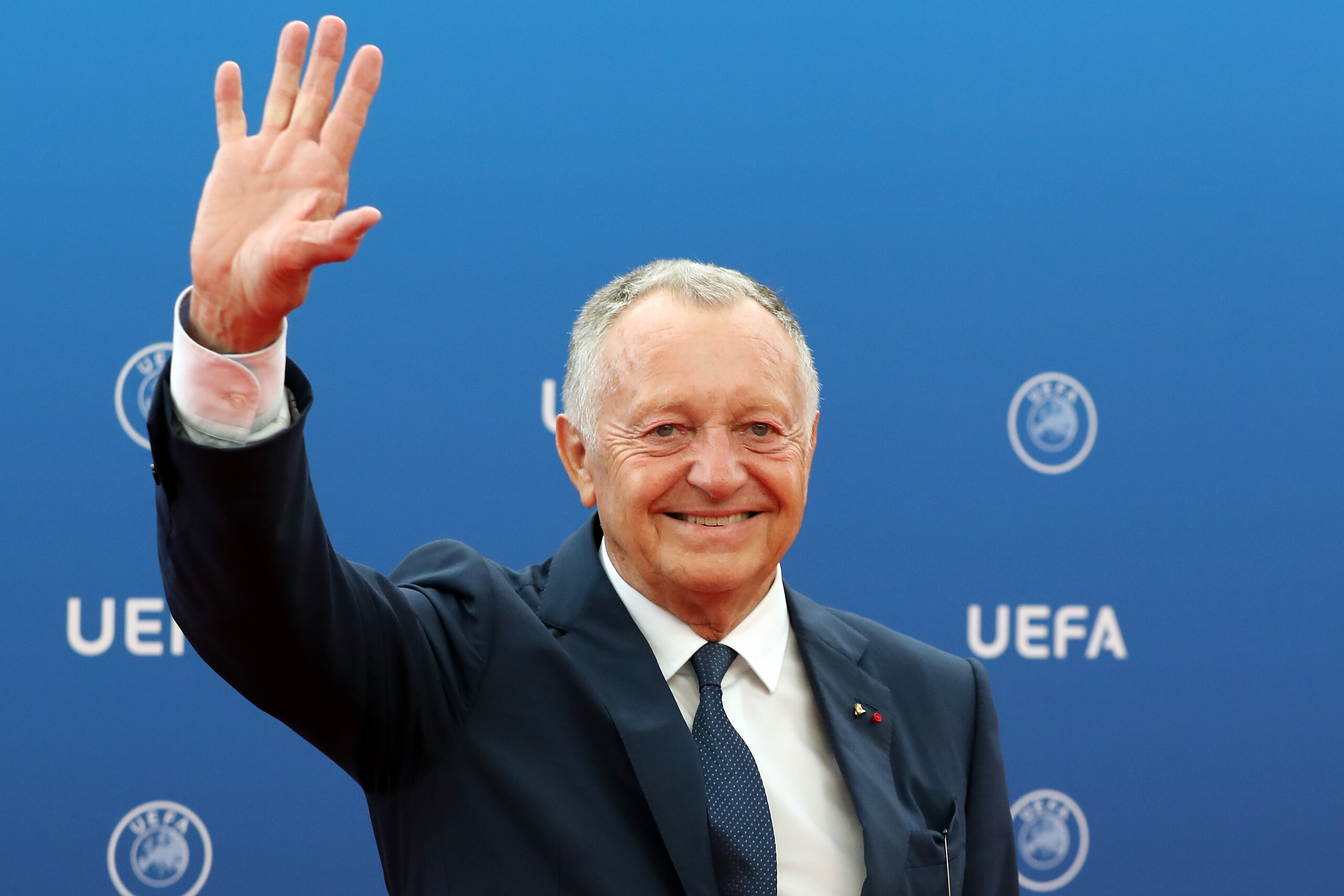 Olympique Lyonnais (OL) president Jean-Michel Aulas arrives to attend the draw for UEFA Champions League football tournament at The Grimaldi Forum in Monaco on August 30, 2018. (Photo by Valery HACHE / AFP)        (Photo credit should read VALERY HACHE/AF