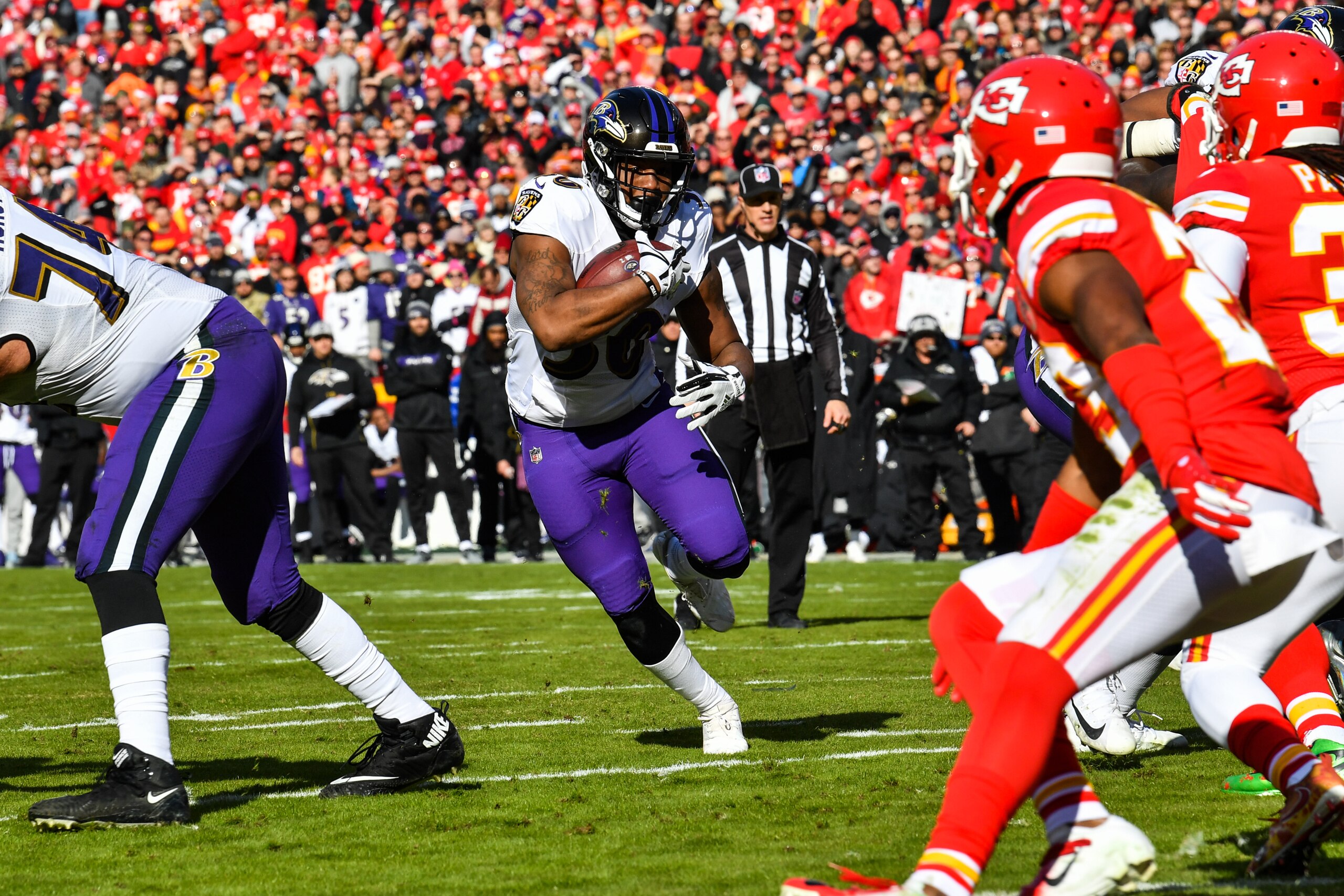 KANSAS CITY, MO - DECEMBER 9: Kenneth Dixon #30 of the Baltimore Ravens runs the ball during the first quarter of the game against the Kansas City Chiefs at Arrowhead Stadium on December 9, 2018 in Kansas City, Missouri. (Photo by Peter Aiken/Getty Images