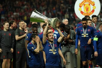 STOCKHOLM, SWEDEN - MAY 24:  Juan Mata of Manchester United celebrates with the trophy at the end of the UEFA Europa League Final between Ajax and Manchester United at Friends Arena on May 24, 2017 in Stockholm, Sweden.  (Photo by Matthew Ashton - AMA/Get