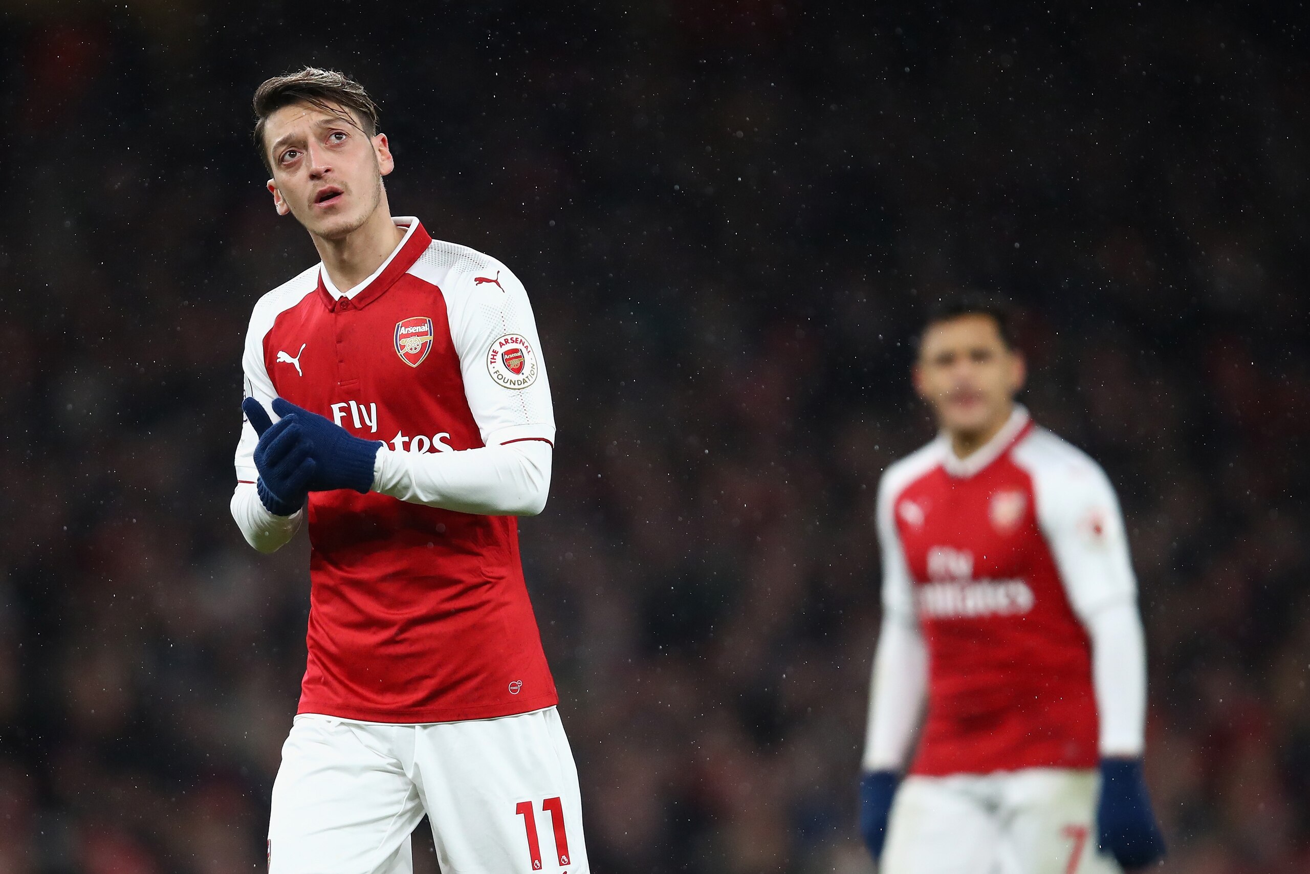 LONDON, ENGLAND - DECEMBER 16:  Mesut Ozil and Alexis Sanchez of Arsenal look on during the Premier League match between Arsenal and Newcastle United at Emirates Stadium on December 16, 2017 in London, England.  (Photo by Julian Finney/Getty Images)