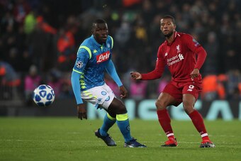 LIVERPOOL, ENGLAND - DECEMBER 11: Kalidou Koulibaly of Napoli and Georginio Wijnaldum of Liverpool during the UEFA Champions League Group C match between Liverpool and SSC Napoli at Anfield on December 11, 2018 in Liverpool, United Kingdom. (Photo by Matt
