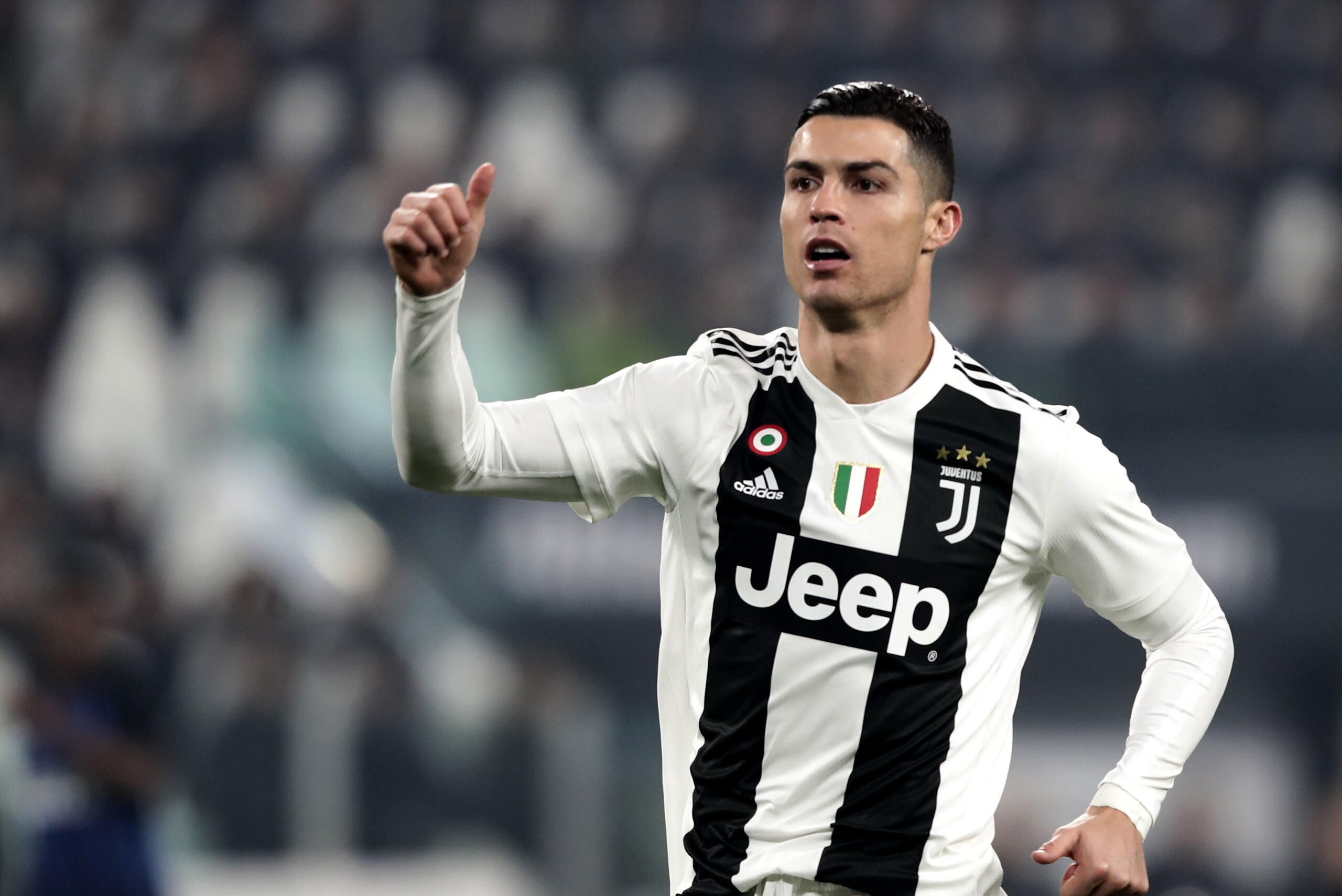 Juventus' Portuguese forward Cristiano Ronaldo celebrates during the Serie A soccer match Juventus vs InterMilan at the Stadio delle Alpi in Turin on December 7, 2018. (Photo by Isabella BONOTTO / AFP)        (Photo credit should read ISABELLA BONOTTO/AFP