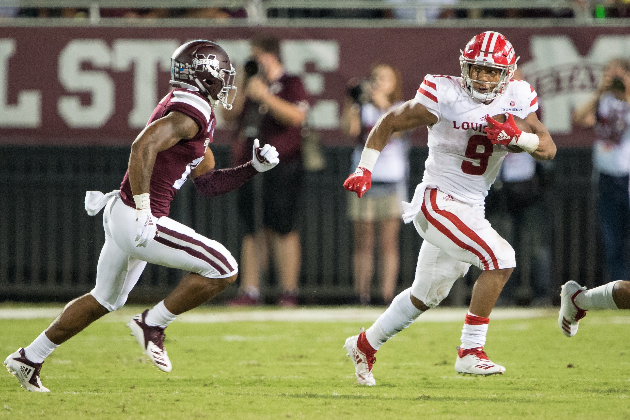 STARKVILLE, MS - SEPTEMBER 15: Running back Trey Ragas #9 of the Louisiana-Lafayette Ragin Cajuns runs the ball by safety Jaquarius Landrews #11 of the Mississippi State Bulldogs during the third quarter on September 15, 2018 at Davis Wade Stadium in Star STARKVILLE, MS - SEPTEMBER 15: Running back Trey Ragas #9 of the Louisiana-Lafayette Ragin Cajuns runs the ball by safety Jaquarius Landrews #11 of the Mississippi State Bulldogs during the third quarter on September 15, 2018 at Davis Wade Stadium in Star