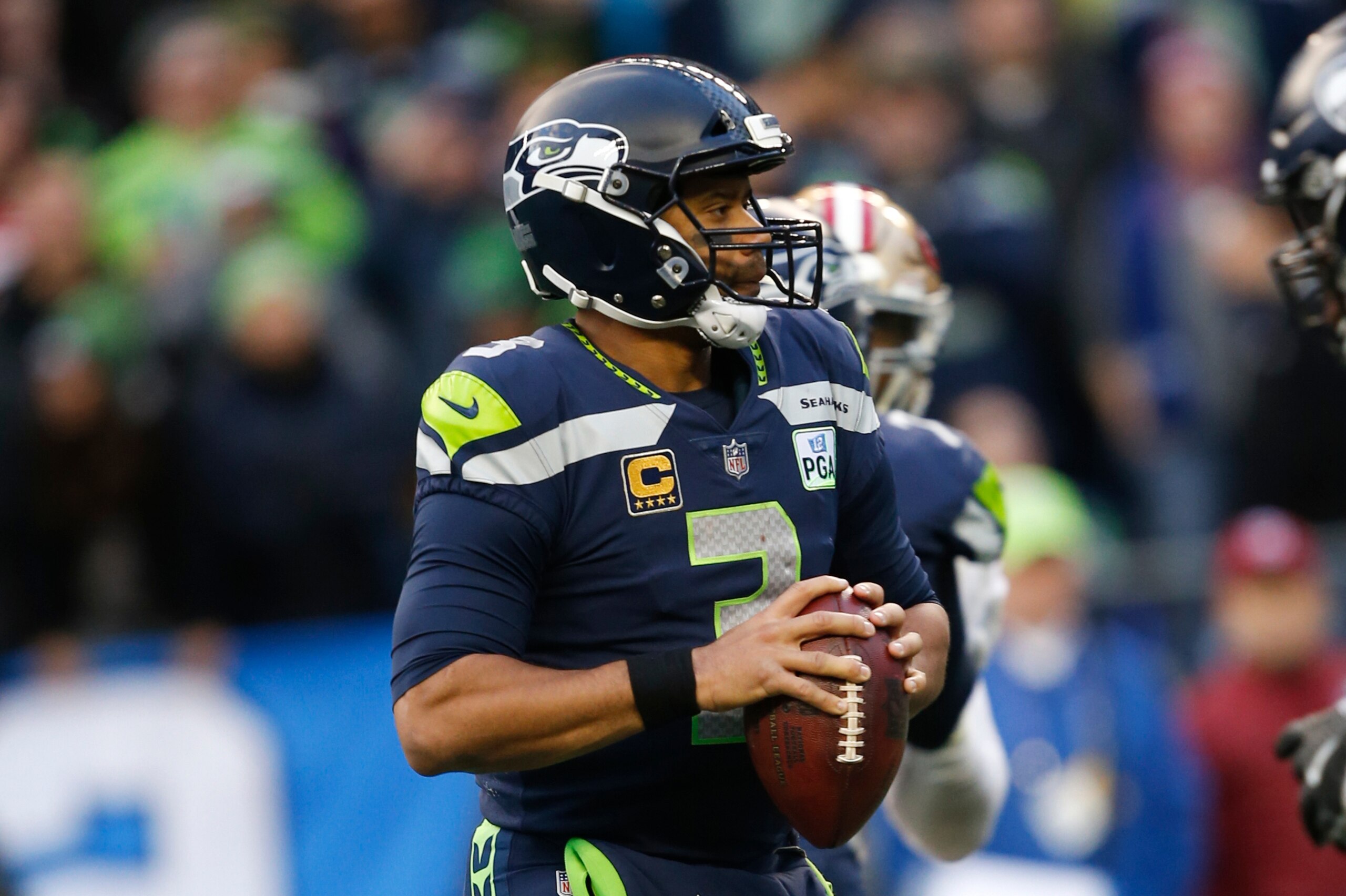 SEATTLE, WA - DECEMBER 2: Russell Wilson #3 of the Seattle Seahawks looks for an open receiver during the game against the San Francisco 49ers at CenturyLink Field on December 2, 2018 in Seattle, Washington. The Seahawks defeated the 49ers 43-16. (Photo b