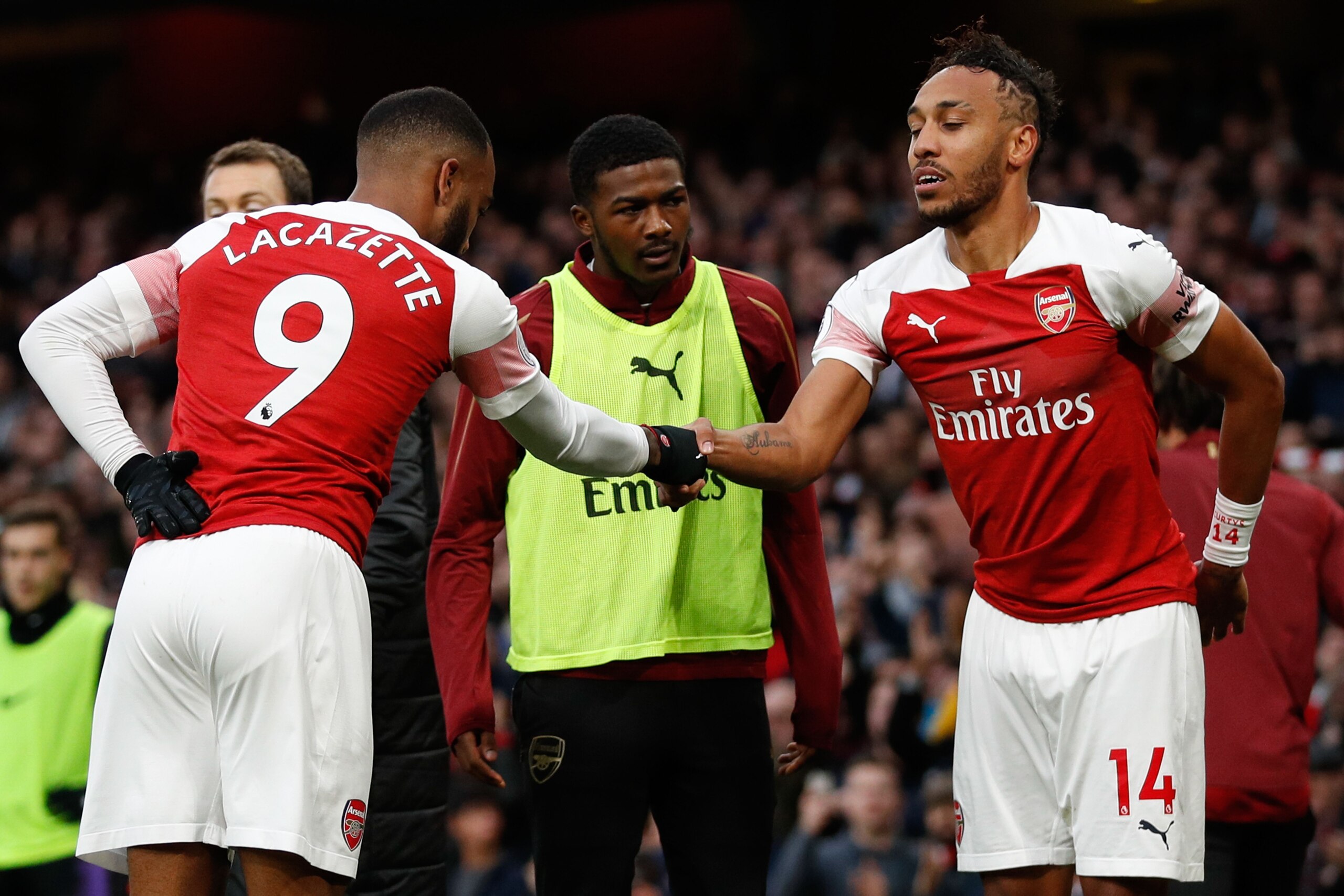 Arsenal's Gabonese striker Pierre-Emerick Aubameyang (R) celebrates with Arsenal's French striker Alexandre Lacazette (L) after scoring their second goal during the English Premier League football match between Arsenal and Tottenham Hotspur at the Emirate