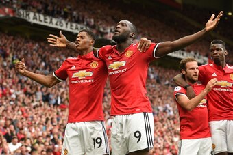 Manchester United's Belgian striker Romelu Lukaku celebrates scoring the opening goal with Manchester United's English striker Marcus Rashford during the English Premier League football match between Manchester United and West Ham United at Old Trafford i