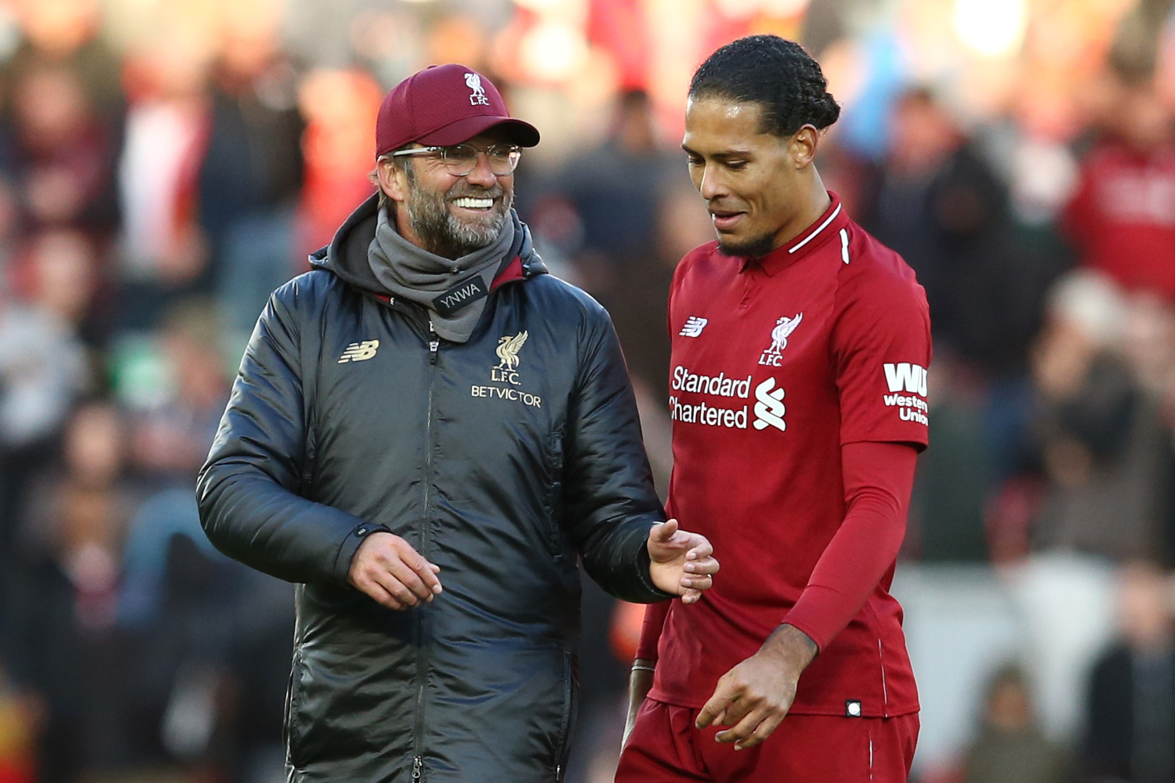 LIVERPOOL, ENGLAND - OCTOBER 27:  Jurgen Klopp, Manager of Liverpool speaks with Virgil van Dijk of Liverpool after the Premier League match between Liverpool FC and Cardiff City at Anfield on October 27, 2018 in Liverpool, United Kingdom.  (Photo by Jan 