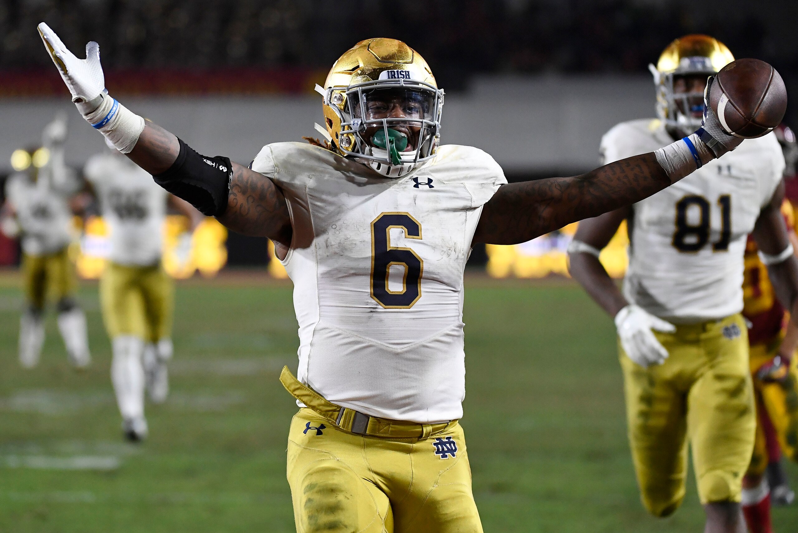 LOS ANGELES, CA - NOVEMBER 24: Tony Jones Jr. #6 of the Notre Dame Fighting Irish scores a touchdown against USC Trojans during the second half at Los Angeles Memorial Coliseum on November 24, 2018 in Los Angeles, California. (Photo by Kevork Djansezian/G
