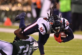 EAST RUTHERFORD, NJ - DECEMBER 15:  Wide receiver DeAndre Hopkins #10 of the Houston Texans is tackled by cornerback Morris Claiborne #21 of the New York Jets during the second half at MetLife Stadium on December 15, 2018 in East Rutherford, New Jersey. T