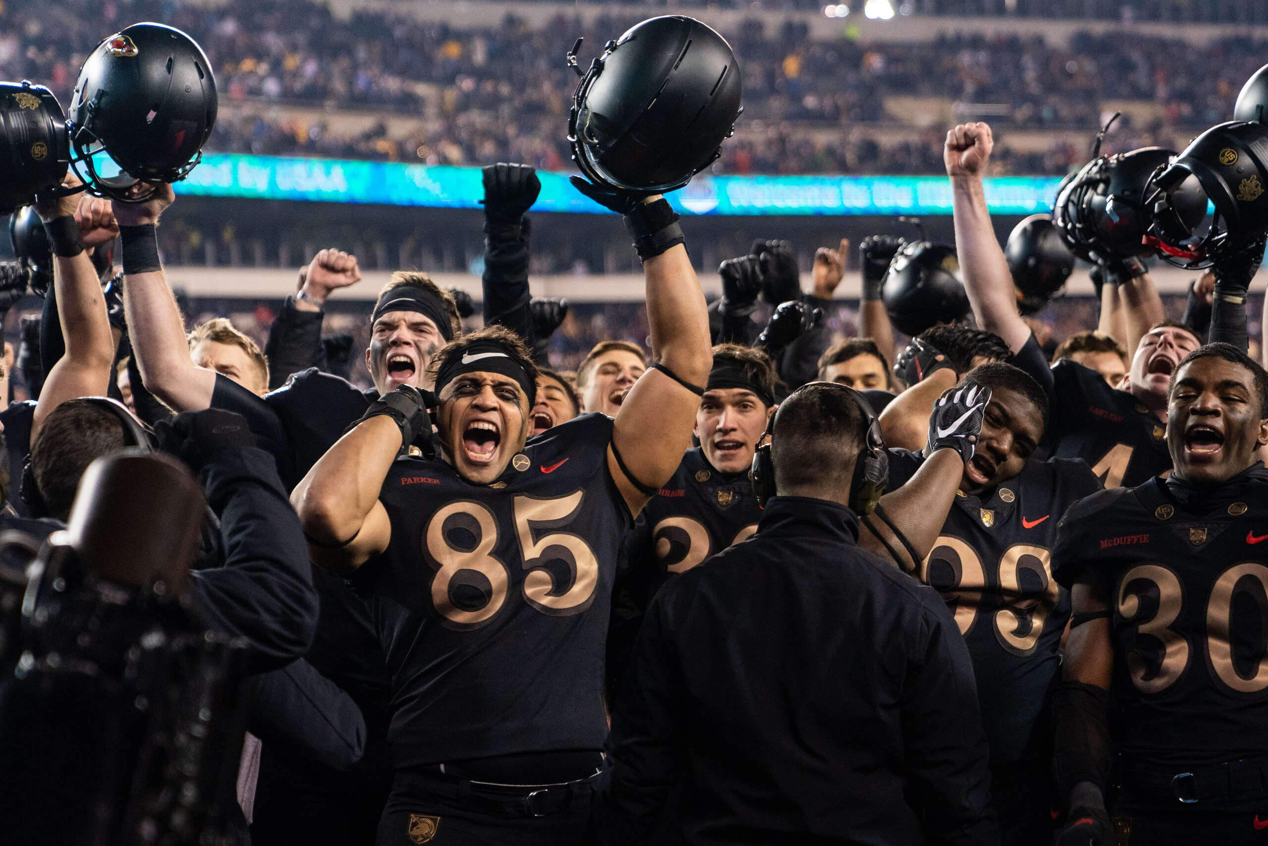 PHILADELPHIA, PA - DECEMBER 08: Quinten Parker #85, Cameron Johnson #30 of the Army Black Knights, and the Army Black Knights sing their alma mater after defeating the Navy Midshipmen at Lincoln Financial Field on December 8, 2018 in Philadelphia, Pennsyl