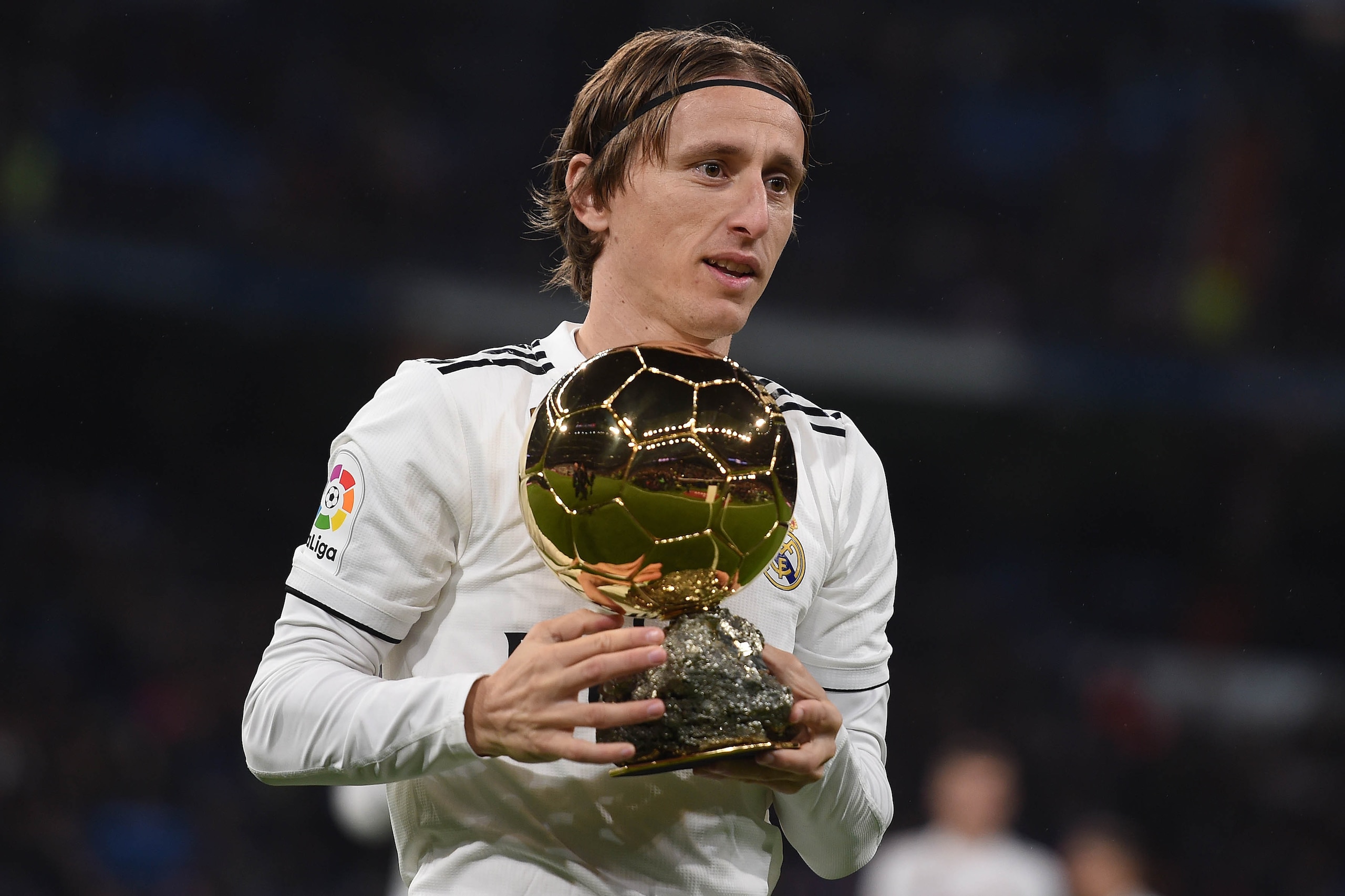 MADRID, SPAIN - DECEMBER 15: Luka Modric of Real Madrid presents his Balon d'Or Trophy to the crown prior to the La Liga match between Real Madrid CF and Rayo Vallecano de Madrid at Estadio Santiago Bernabeu on December 15, 2018 in Madrid, Spain. (Photo b