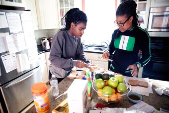 Andraya (left) and her mother, Ngozi Nnaji (right), at their home.