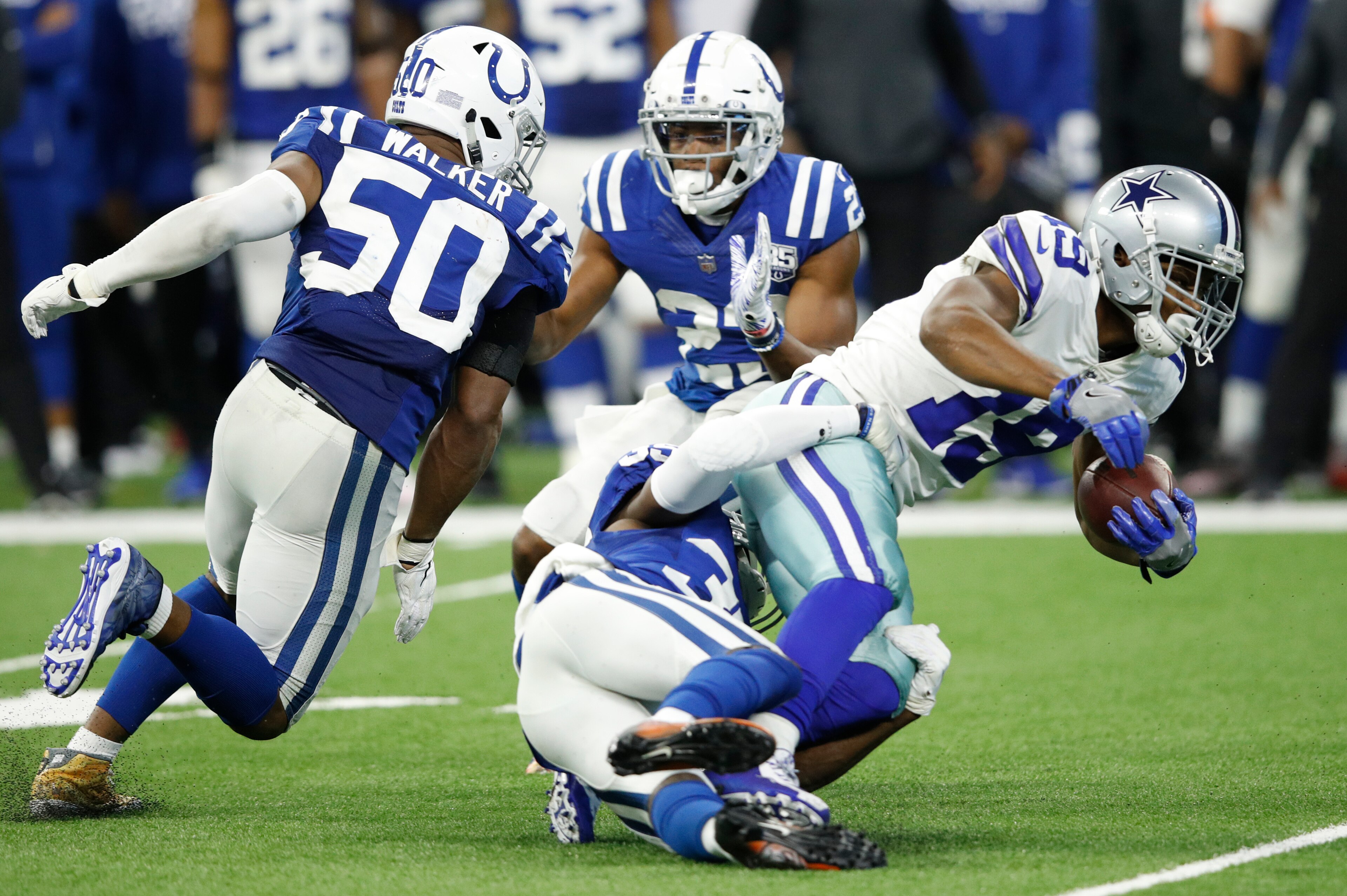 INDIANAPOLIS, INDIANA - DECEMBER 16: Amari Cooper #19 of the Dallas Cowboys is tackled by the Indianapolis Colts defense  in the fourth quarter at Lucas Oil Stadium on December 16, 2018 in Indianapolis, Indiana. (Photo by Joe Robbins/Getty Images)