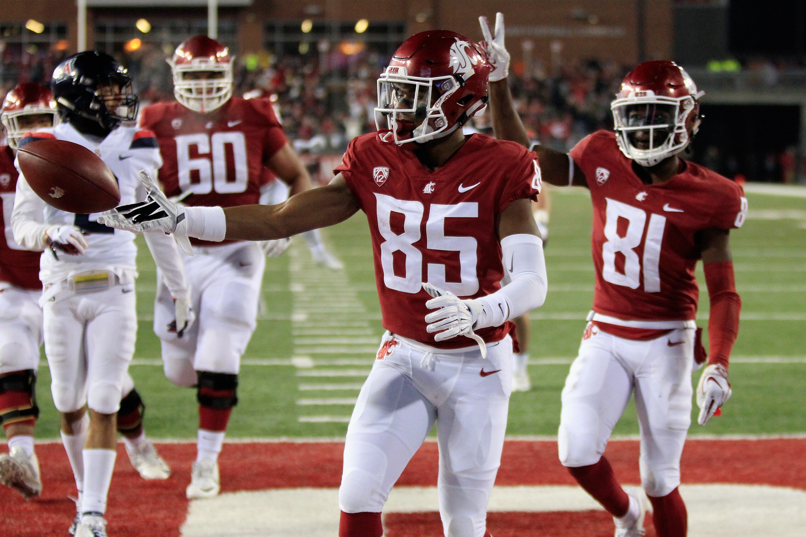 PULLMAN, WA - NOVEMBER 17:  Calvin Jackson Jr. #85 of the Washington State Cougars scores a touchdown against the Arizona Wildcats in the first half at Martin Stadium on November 17, 2018 in Pullman, Washington.  (Photo by William Mancebo/Getty Images)