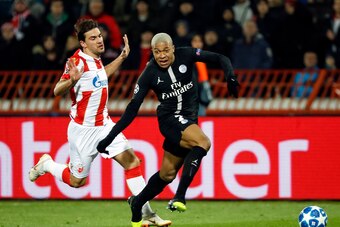 BELGRADE, SERBIA - DECEMBER 11: Kylian Mbappe (R) of Paris Saint-Germain in action against Filip Stojkovic (R) of Red Star Belgrade during the UEFA Champions League Group C match between Red Star Belgrade and Paris Saint-Germain at Rajko Mitic Stadium on 