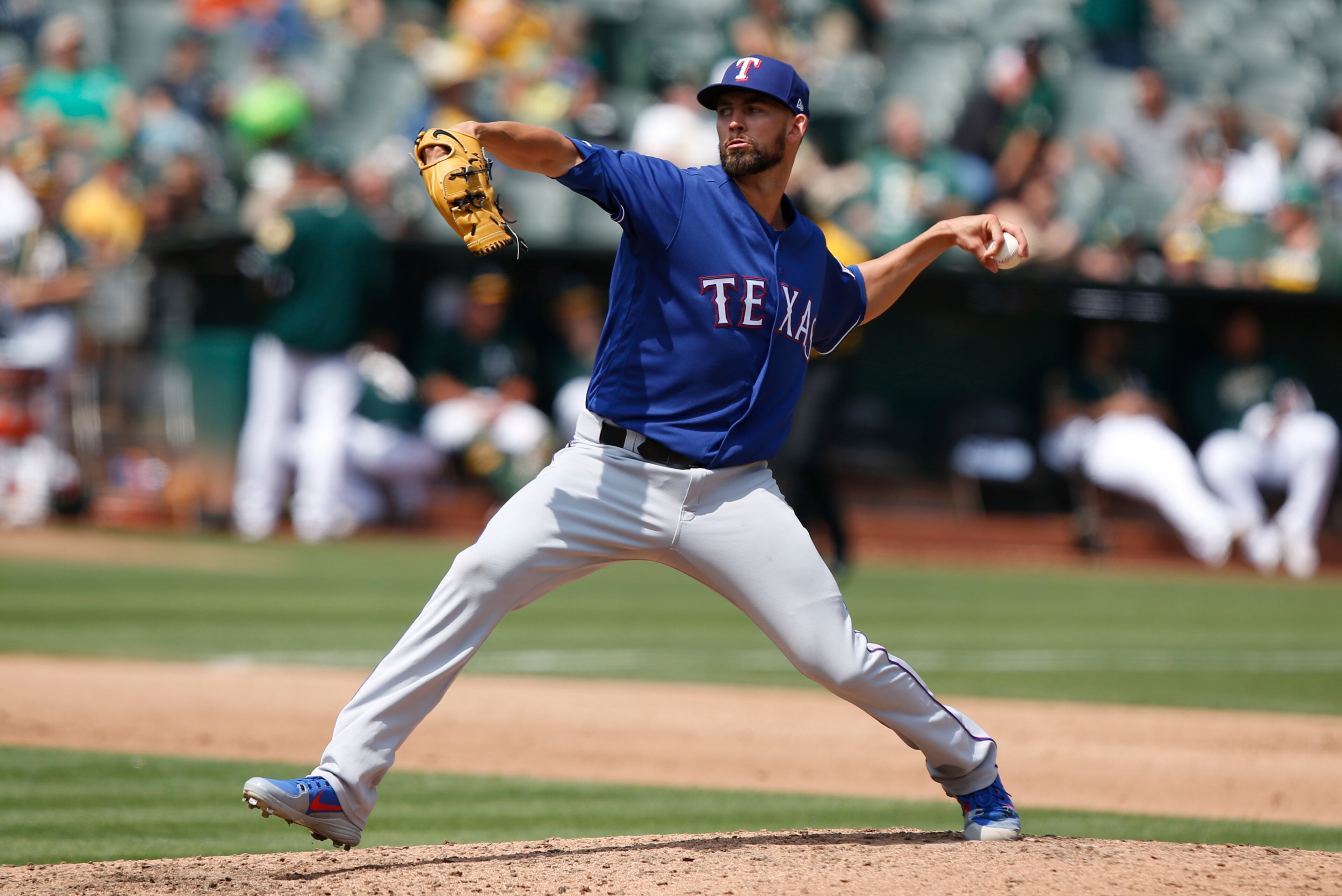 OAKLAND, CA - AUGUST 22: Mike Minor #36 of the Texas Rangers pitches during the game against the Oakland Athletics at the Oakland Alameda Coliseum on August 22, 2018 in Oakland, California. The Rangers defeated the Athletics 4-2. (Photo by Michael Zagaris