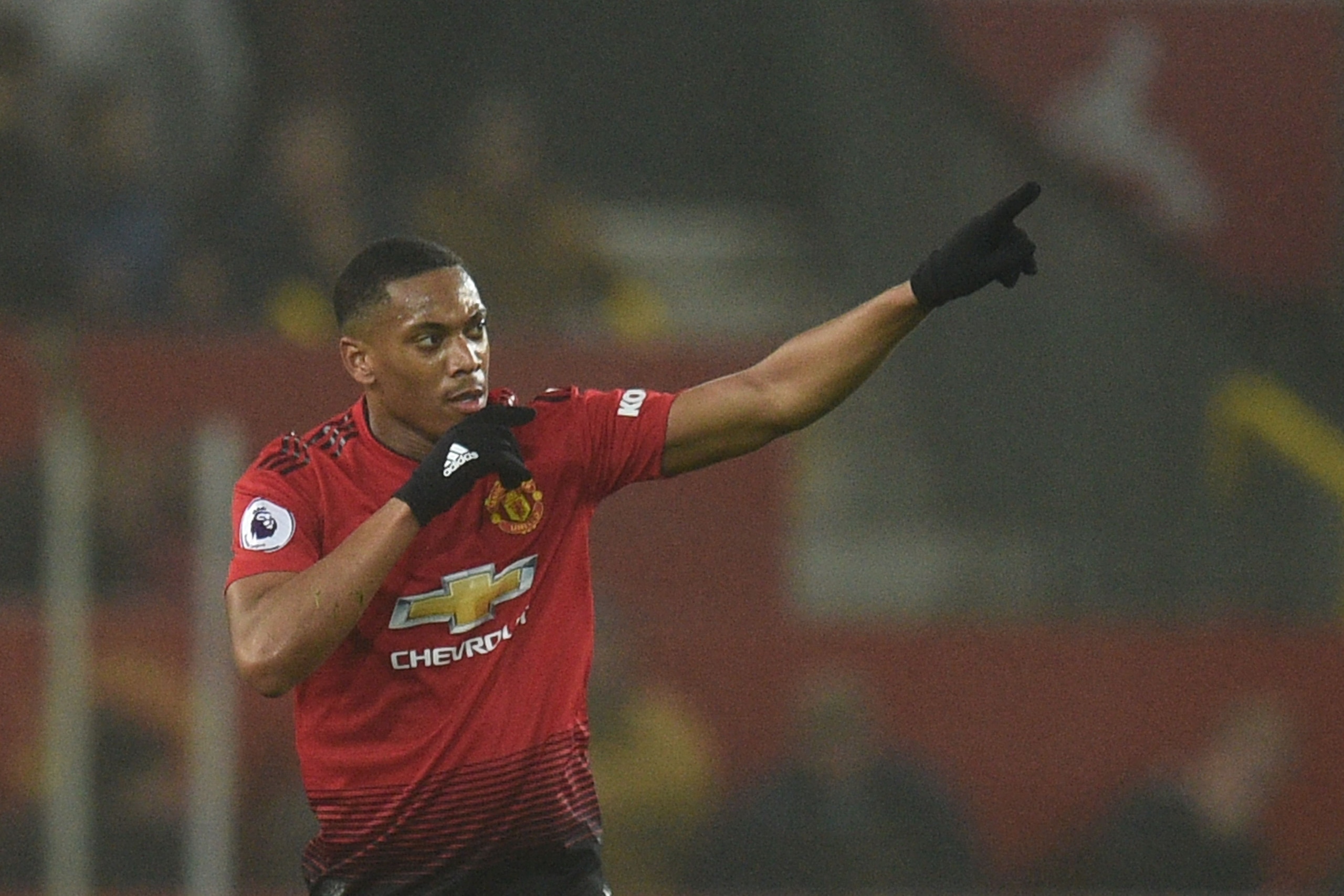 Manchester United's French striker Anthony Martial celebrates scoring their first goal to equalise 1-1 during the English Premier League football match between Manchester United and Arsenal at Old Trafford in Manchester, north west England, on December 5,