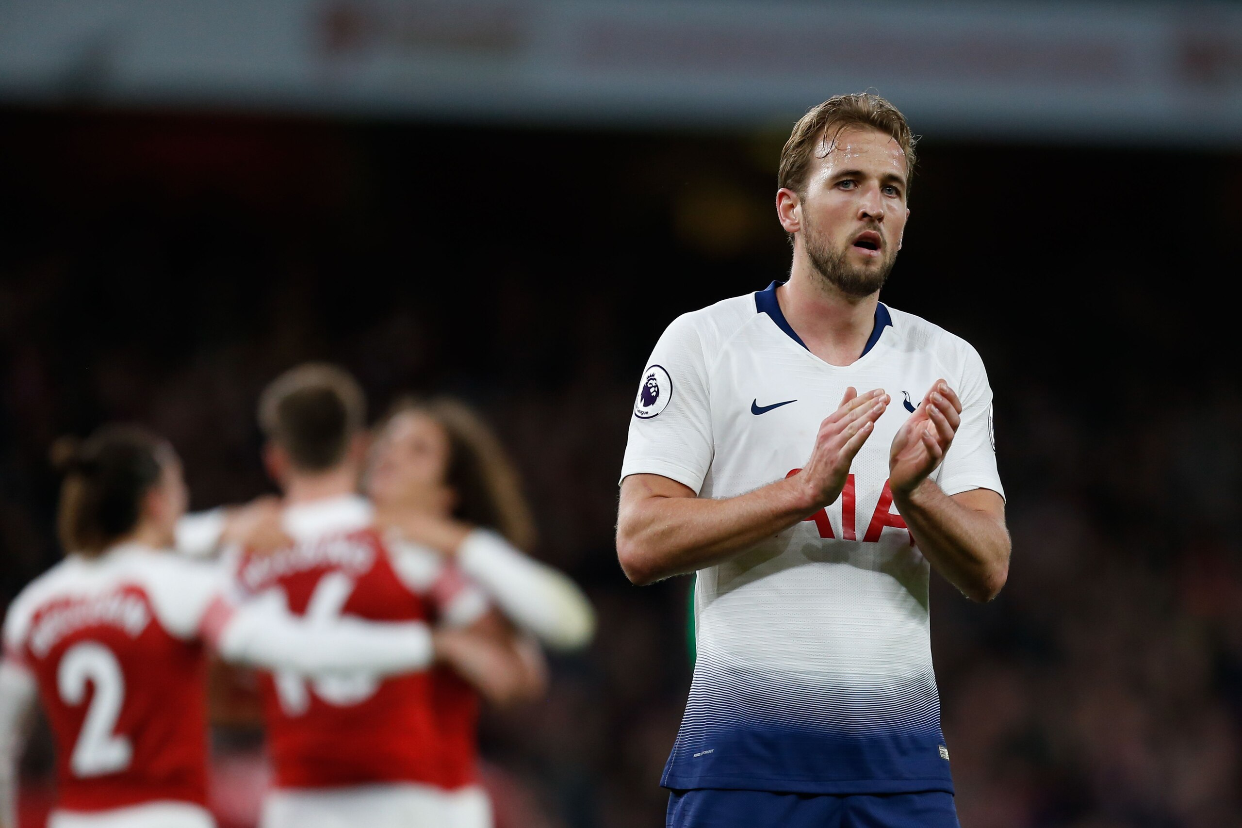 Tottenham Hotspur's English striker Harry Kane applauds as Arsenal players celebrate on the pitch after the English Premier League football match between Arsenal and Tottenham Hotspur at the Emirates Stadium in London on December 2, 2018. - Arsenal won th Tottenham Hotspur's English striker Harry Kane applauds as Arsenal players celebrate on the pitch after the English Premier League football match between Arsenal and Tottenham Hotspur at the Emirates Stadium in London on December 2, 2018. - Arsenal won th