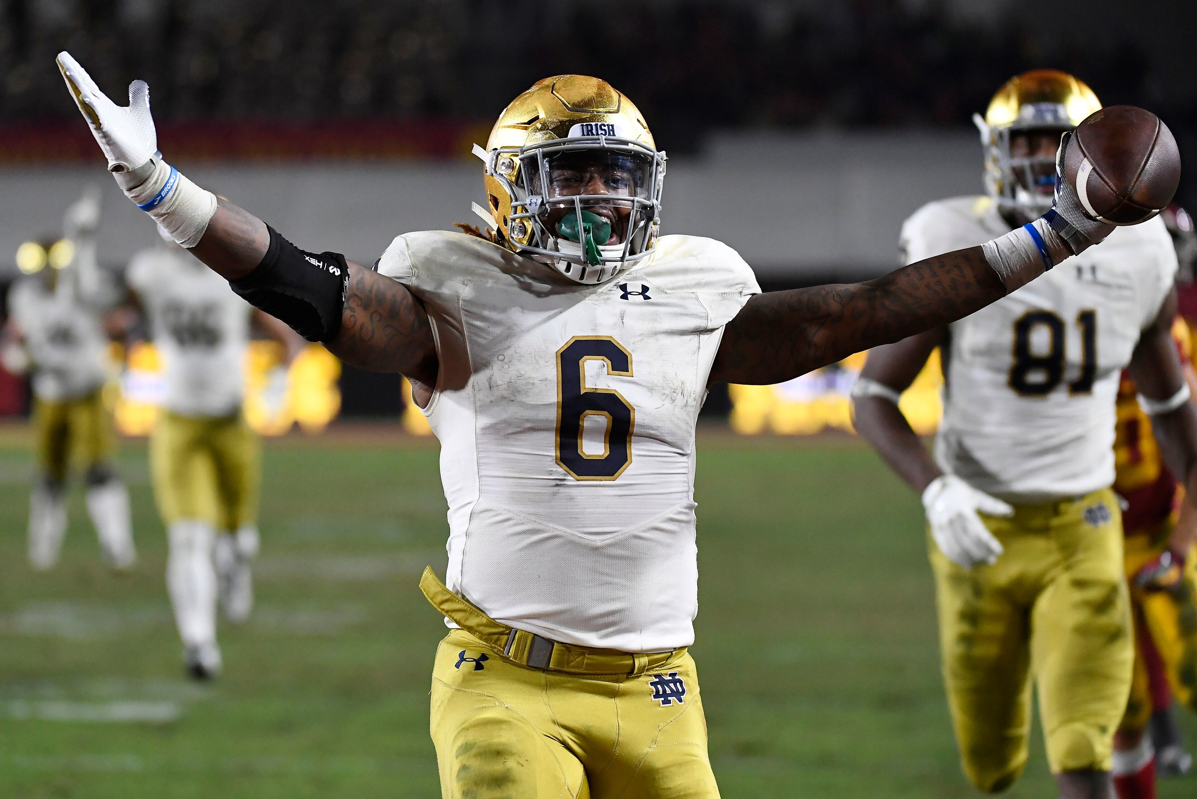 LOS ANGELES, CA - NOVEMBER 24: Tony Jones Jr. #6 of the Notre Dame Fighting Irish scores a touchdown against USC Trojans during the second half at Los Angeles Memorial Coliseum on November 24, 2018 in Los Angeles, California. (Photo by Kevork Djansezian/G