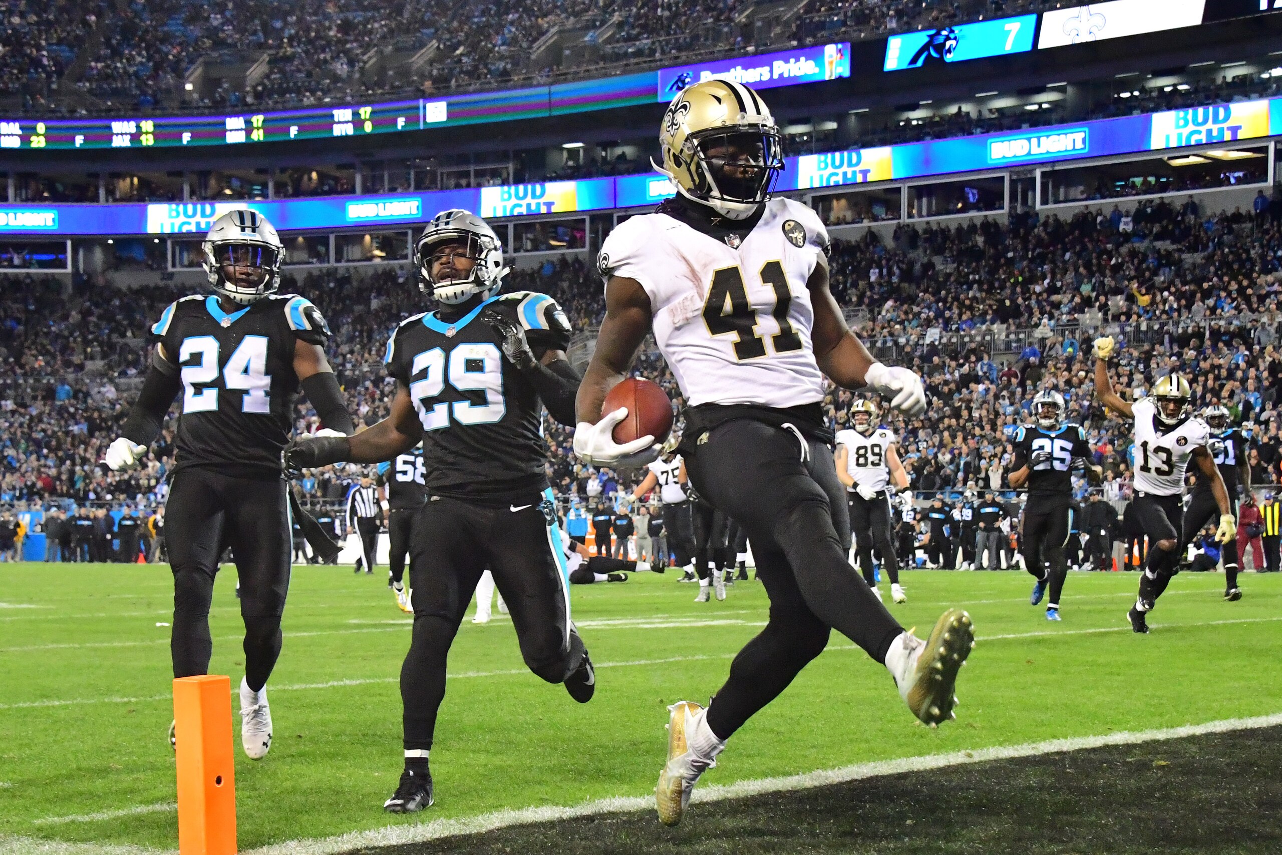 CHARLOTTE, NC - DECEMBER 17: Alvin Kamara #41 of the New Orleans Saints scores a second half touchdown against the Carolina Panthers during the fourth quarter at Bank of America Stadium on December 17, 2018 in Charlotte, North Carolina. (Photo by Scott Cu