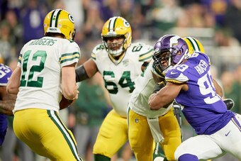 MINNEAPOLIS, MN - NOVEMBER 25: Danielle Hunter #99 of the Minnesota Vikings attempts to get to Aaron Rodgers #12 of the Green Bay Packers during the game at U.S. Bank Stadium on November 25, 2018 in Minneapolis, Minnesota. (Photo by Hannah Foslien/Getty I