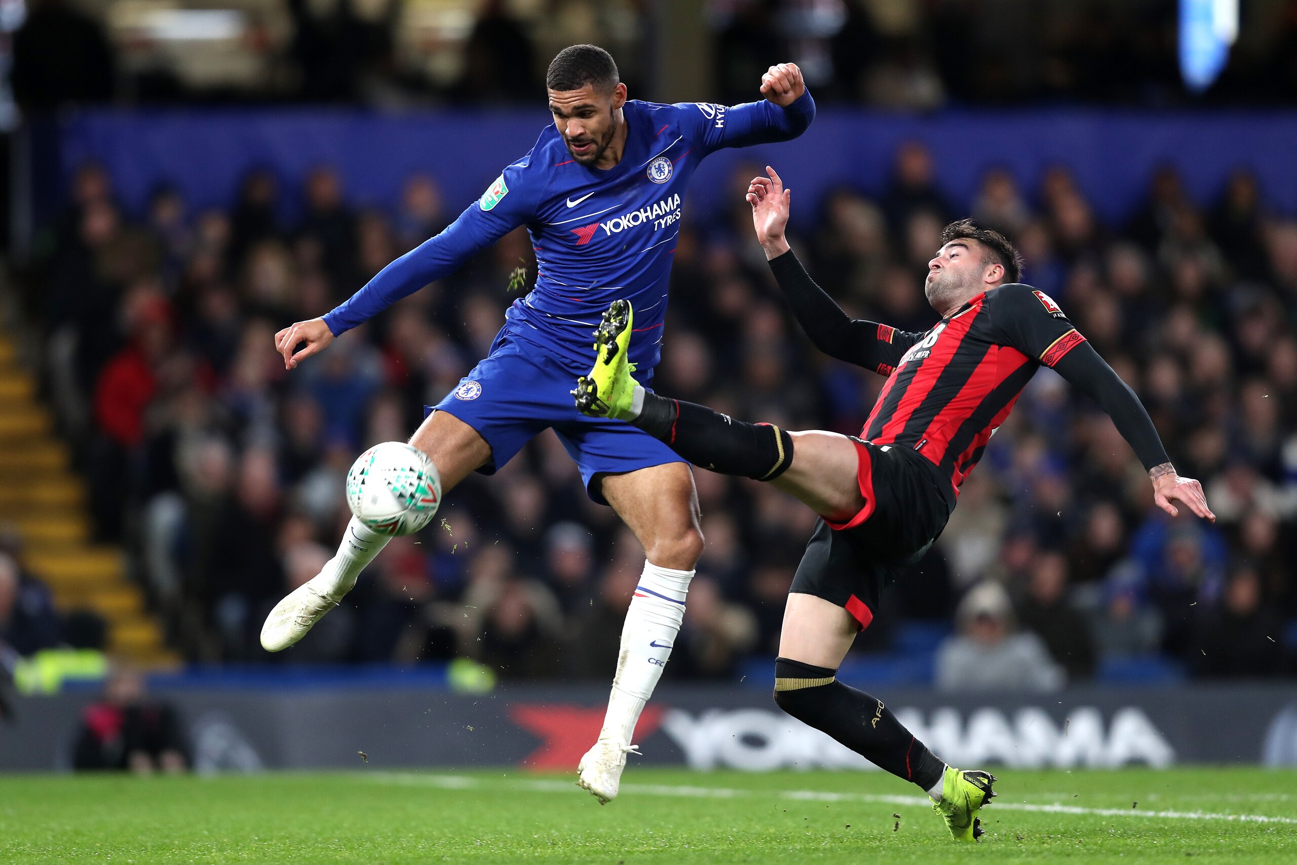 LONDON, ENGLAND - DECEMBER 19: Ruben Loftus-Cheek of Chelsea is challenged by Diego Rico of AFC Bournemouth during the Carabao Cup Quarter Final match between Chelsea and AFC Bournemouth at Stamford Bridge on December 19, 2018 in London, United Kingdom.  