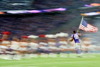 MINNEAPOLIS, MN - NOVEMBER 4: Danielle Hunter #99 of the Minnesota Vikings carries the flag onto the field during player introductions before the game against the Detroit Lions at U.S. Bank Stadium on November 4, 2018 in Minneapolis, Minnesota. (Photo by 