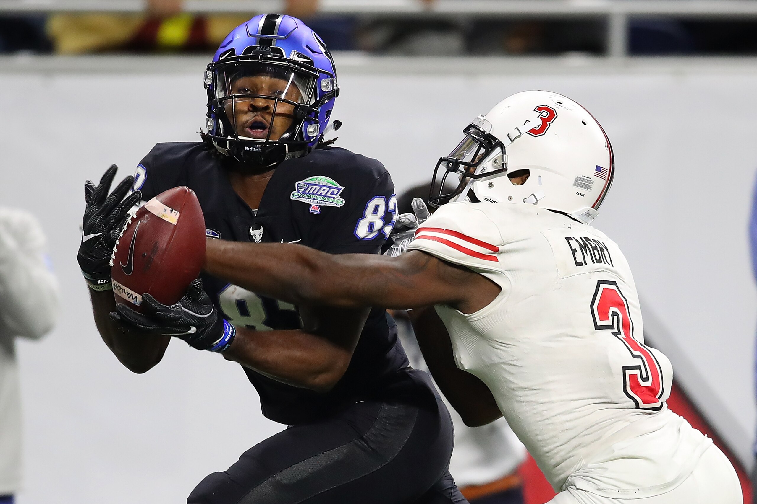 DETROIT, MICHIGAN - NOVEMBER 30: Anthony Johnson #83 of the Buffalo Bulls can't come up with a late fourth quarter catch in front of Jalen Embry #3 of the Northern Illinois Huskies during the MAC Championship at Ford Field on November 30, 2018 in Detroit, DETROIT, MICHIGAN - NOVEMBER 30: Anthony Johnson #83 of the Buffalo Bulls can't come up with a late fourth quarter catch in front of Jalen Embry #3 of the Northern Illinois Huskies during the MAC Championship at Ford Field on November 30, 2018 in Detroit,