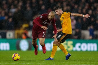 WOLVERHAMPTON, ENGLAND - DECEMBER 21: Fabinho of Liverpool and Ruben Neves of Wolverhampton Wanderers during the Premier League match between Wolverhampton Wanderers and Liverpool FC at Molineux on December 21, 2018 in Wolverhampton, United Kingdom. (Phot