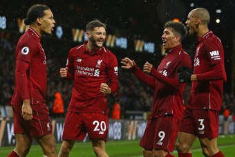 Liverpool's Dutch defender Virgil van Dijk (L) celebrates with Liverpool's English midfielder Adam Lallana (2nd L), Liverpool's Brazilian midfielder Roberto Firmino (2nd R) and Liverpool's Brazilian midfielder Fabinho (R) after scoring their second goal d