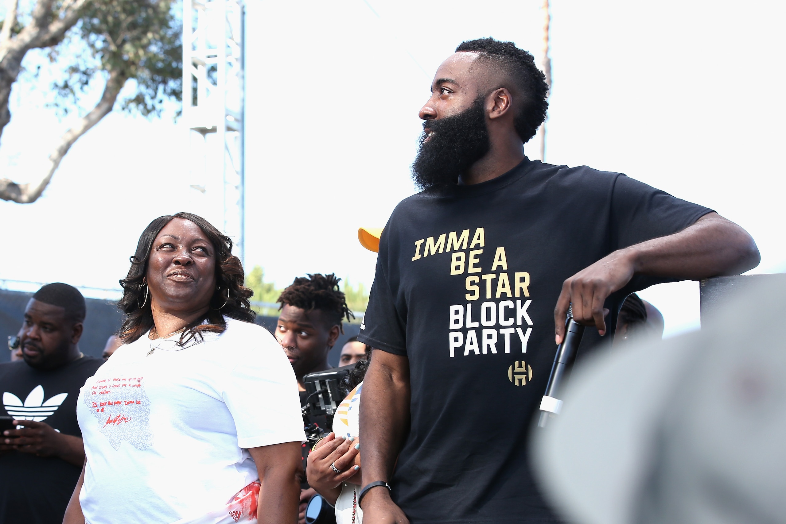 LOS ANGELES, CA - JUNE 24:  James Harden (R) and Monja Willis onstage at 'Imma Be a Star' Block Party at Audubon Middle School on June 24, 2018 in Los Angeles, California.  (Photo by Phillip Faraone/Getty Images for adidas)