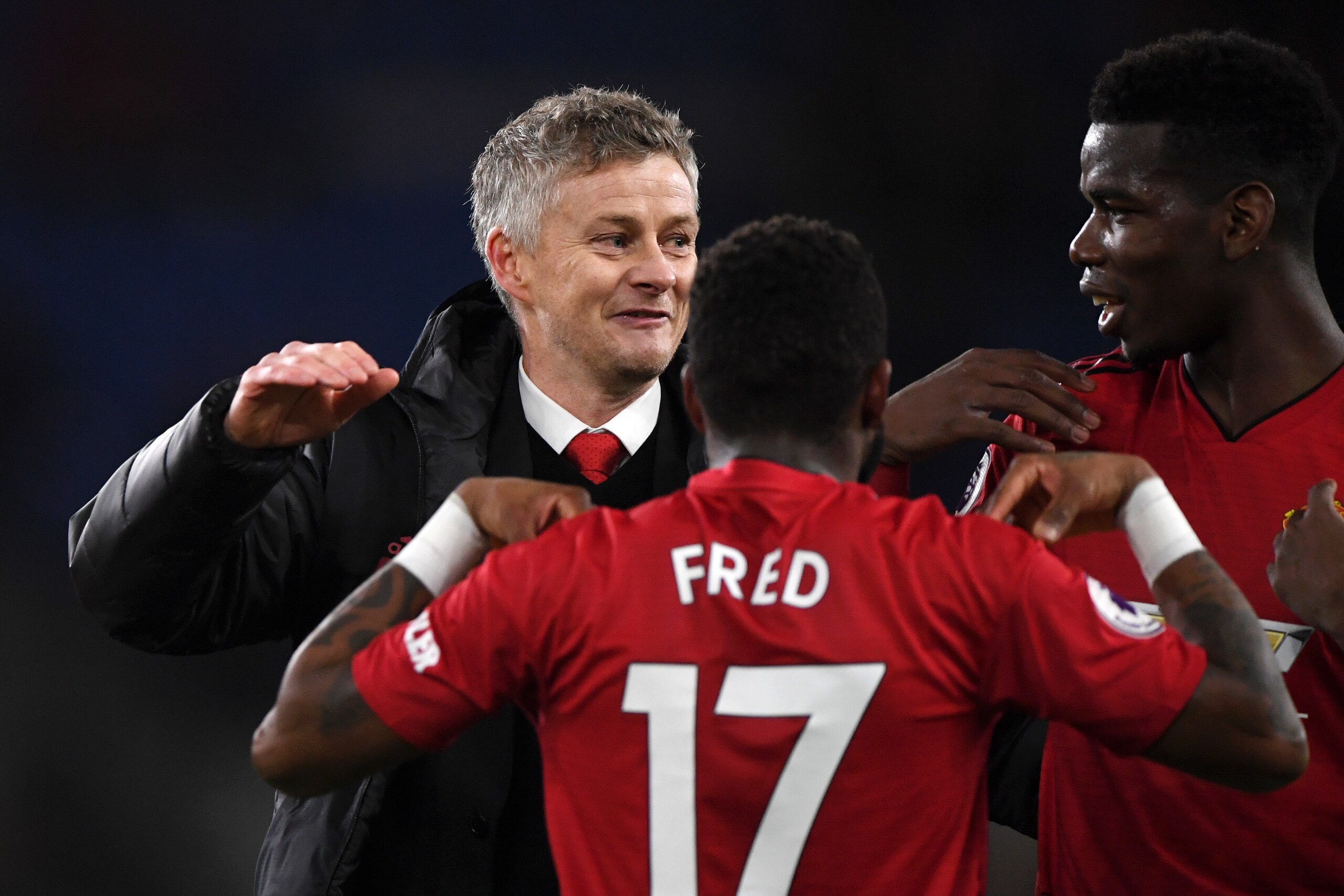 CARDIFF, WALES - DECEMBER 22:  Ole Gunnar Solskjaer, Interim Manager of Manchester United celebrates with Fred and Paul Pogba of Manchester United following the final whistle of the Premier League match between Cardiff City and Manchester United at Cardif