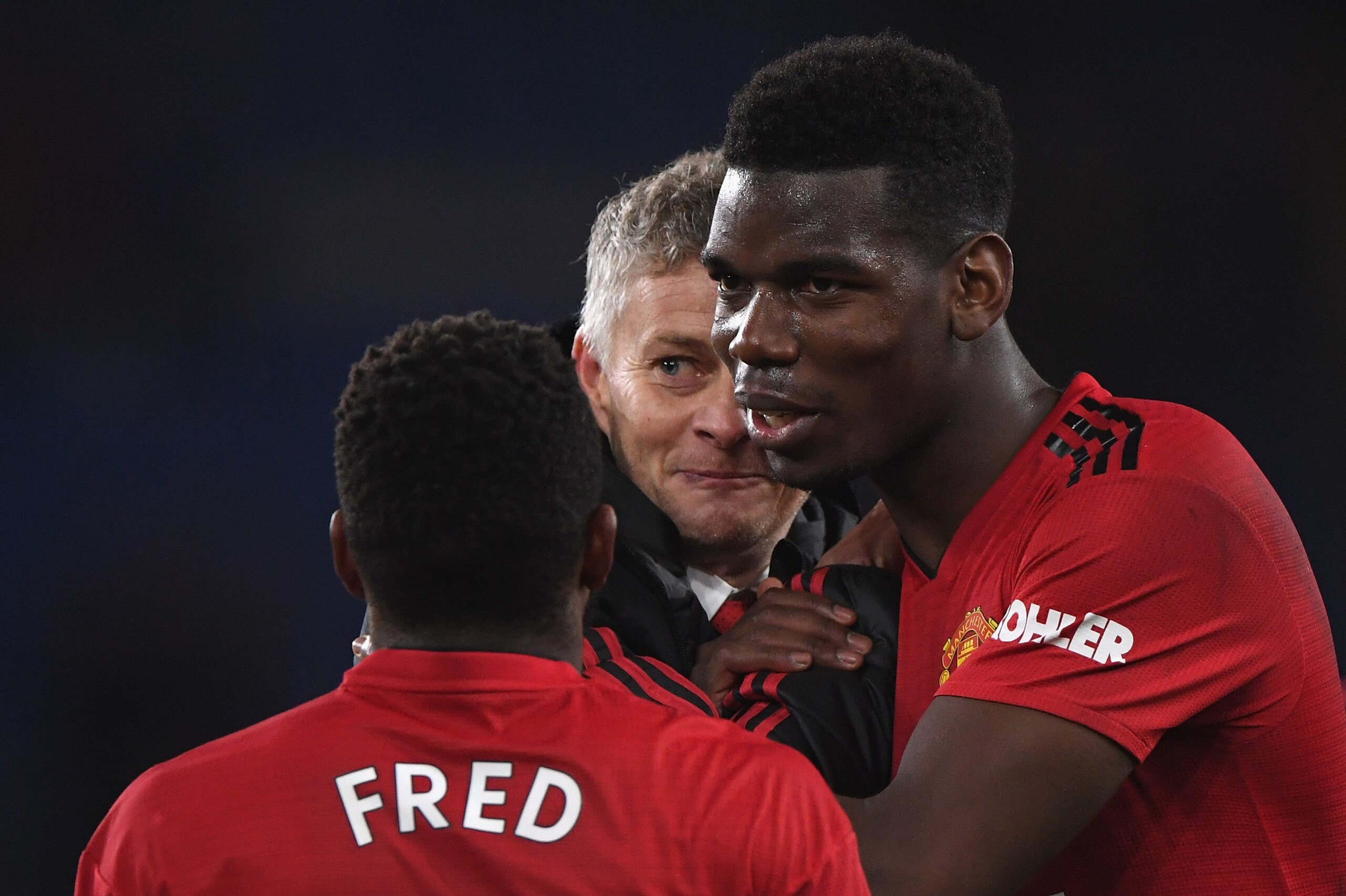 CARDIFF, WALES - DECEMBER 22:  Ole Gunnar Solskjaer, Interim Manager of Manchester United celebrates with Fred and Paul Pogba after the Premier League match between Cardiff City and Manchester United at Cardiff City Stadium on December 22, 2018 in Cardiff