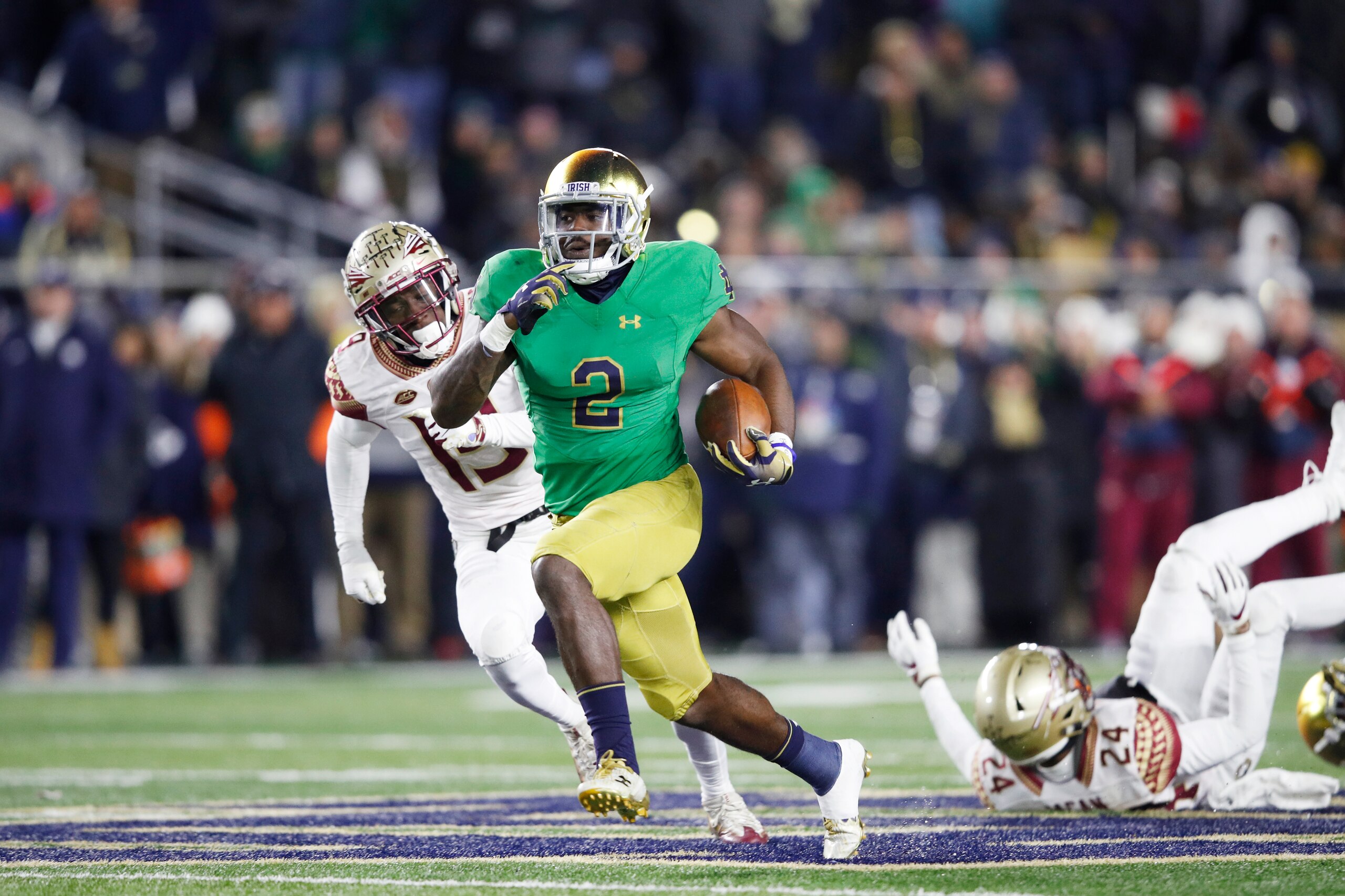 SOUTH BEND, IN - NOVEMBER 10: Dexter Williams #2 of the Notre Dame Fighting Irish runs the ball for a 58-yard touchdown during the game against the Florida State Seminoles at Notre Dame Stadium on November 10, 2018 in South Bend, Indiana. Notre Dame won 4