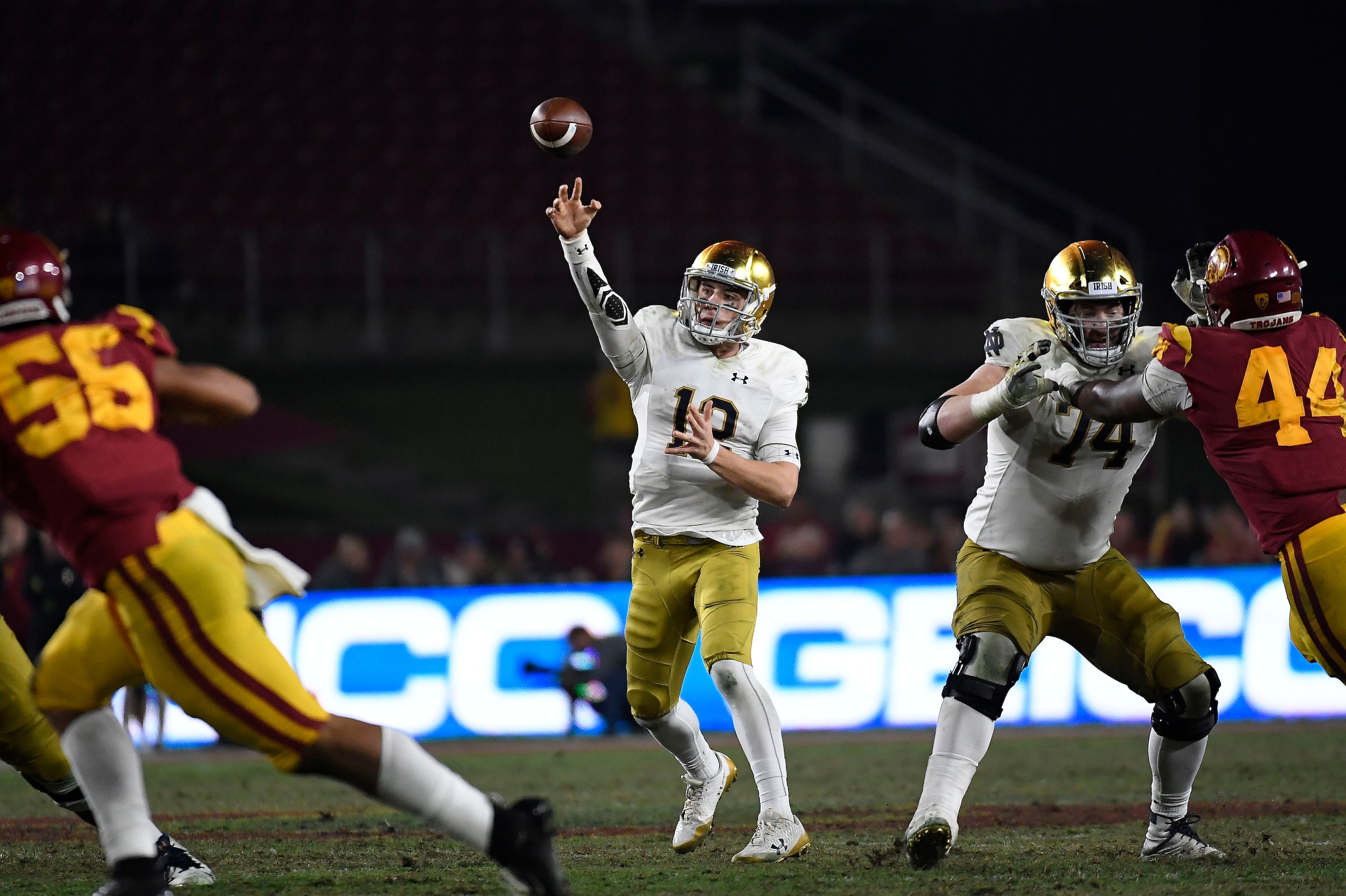 LOS ANGELES, CA - NOVEMBER 24: Quarterback Ian Book #12 of the Notre Dame Fighting Irish throws a pass against the USC Trojans during the second half at Los Angeles Memorial Coliseum on November 24, 2018 in Los Angeles, California. (Photo by Kevork Djanse
