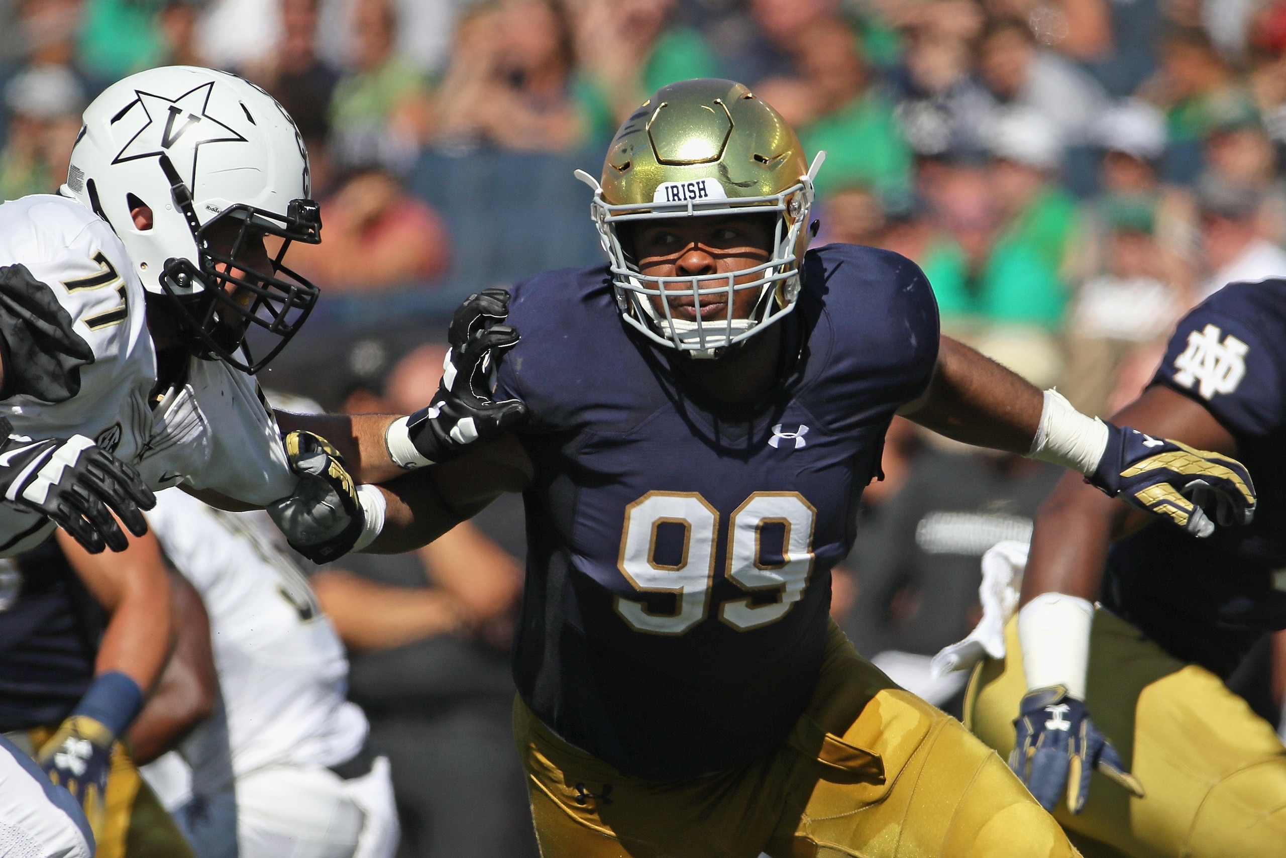 SOUTH BEND, IN - SEPTEMBER 15:  Jerry Tillery #99 of the Notre Dame Fighting Irish rushes against Devin Cochran #77 of the Vanderbilt Commodores at Notre Dame Stadium on September 15, 2018 in South Bend, Indiana. Notre Dame defeated Vanderbilt 22-17.  (Ph