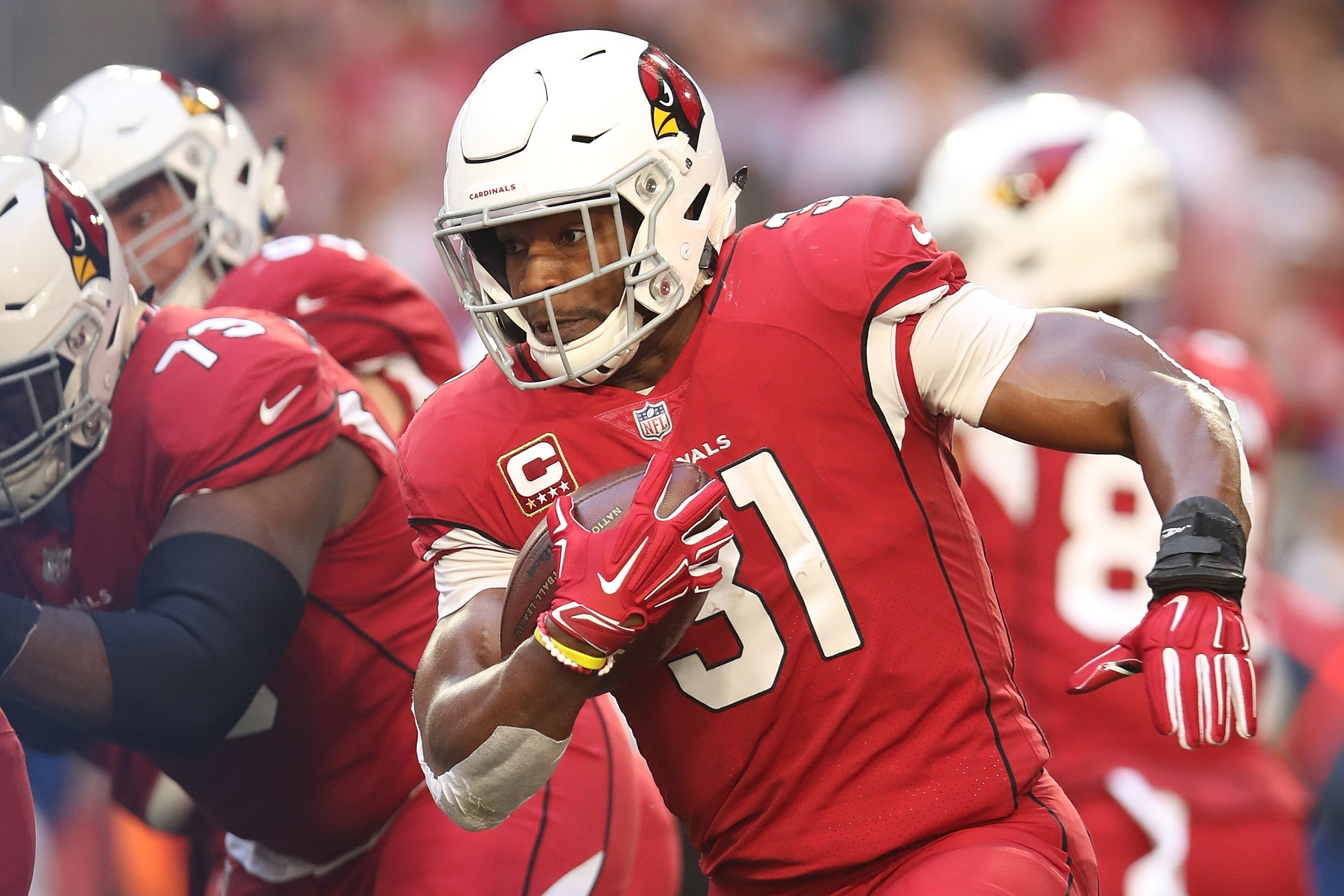 GLENDALE, ARIZONA - DECEMBER 23: David Johnson #31 of the Arizona Cardinals runs with the football in the first half of the NFL game against the Los Angeles Rams at State Farm Stadium on December 23, 2018 in Glendale, Arizona. (Photo by Christian Petersen