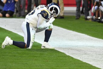 GLENDALE, ARIZONA - DECEMBER 23: C.J. Anderson #35 of the Los Angeles Rams celebrates a four yard touchdown in the first half of the NFL game against the Arizona Cardinals at State Farm Stadium on December 23, 2018 in Glendale, Arizona. (Photo by Norm Hal
