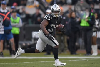 OAKLAND, CA - DECEMBER 09:  Jalen Richard #30 of the Oakland Raiders carries the ball against the Pittsburgh Steelers during the second half of an NFL football game at Oakland-Alameda County Coliseum on December 9, 2018 in Oakland, California.  (Photo by 