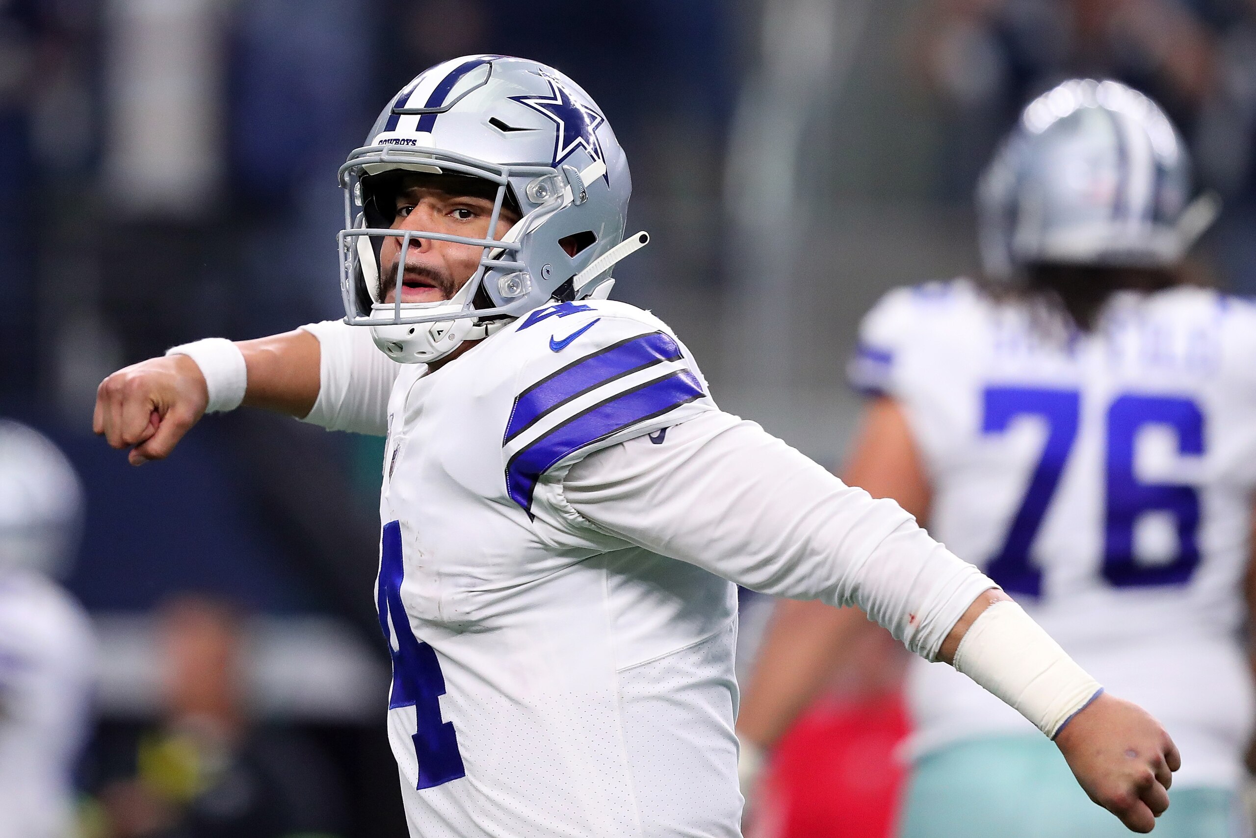 ARLINGTON, TEXAS - DECEMBER 23: Dak Prescott #4 of the Dallas Cowboys reacts after throwing a touchdown pass against the Tampa Bay Buccaneers in the third quarter at AT&T Stadium on December 23, 2018 in Arlington, Texas. (Photo by Tom Pennington/Getty Ima