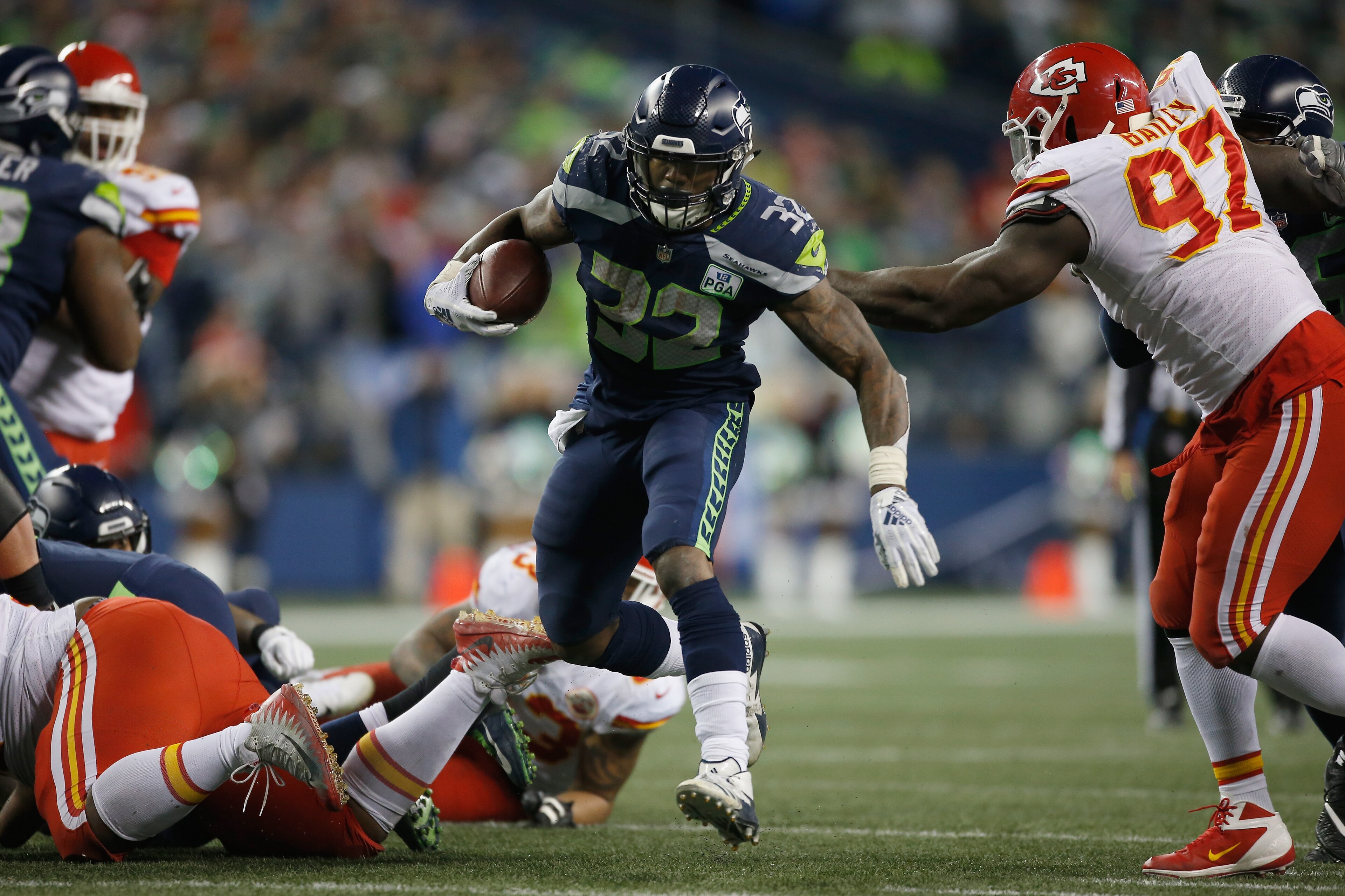 SEATTLE, WA - DECEMBER 23:  Chris Carson #32 of the Seattle Seahawks carries the ball against the Kansas City Chiefs during the fourth quarter of the game at CenturyLink Field on December 23, 2018 in Seattle, Washington.  (Photo by Otto Greule Jr/Getty Im